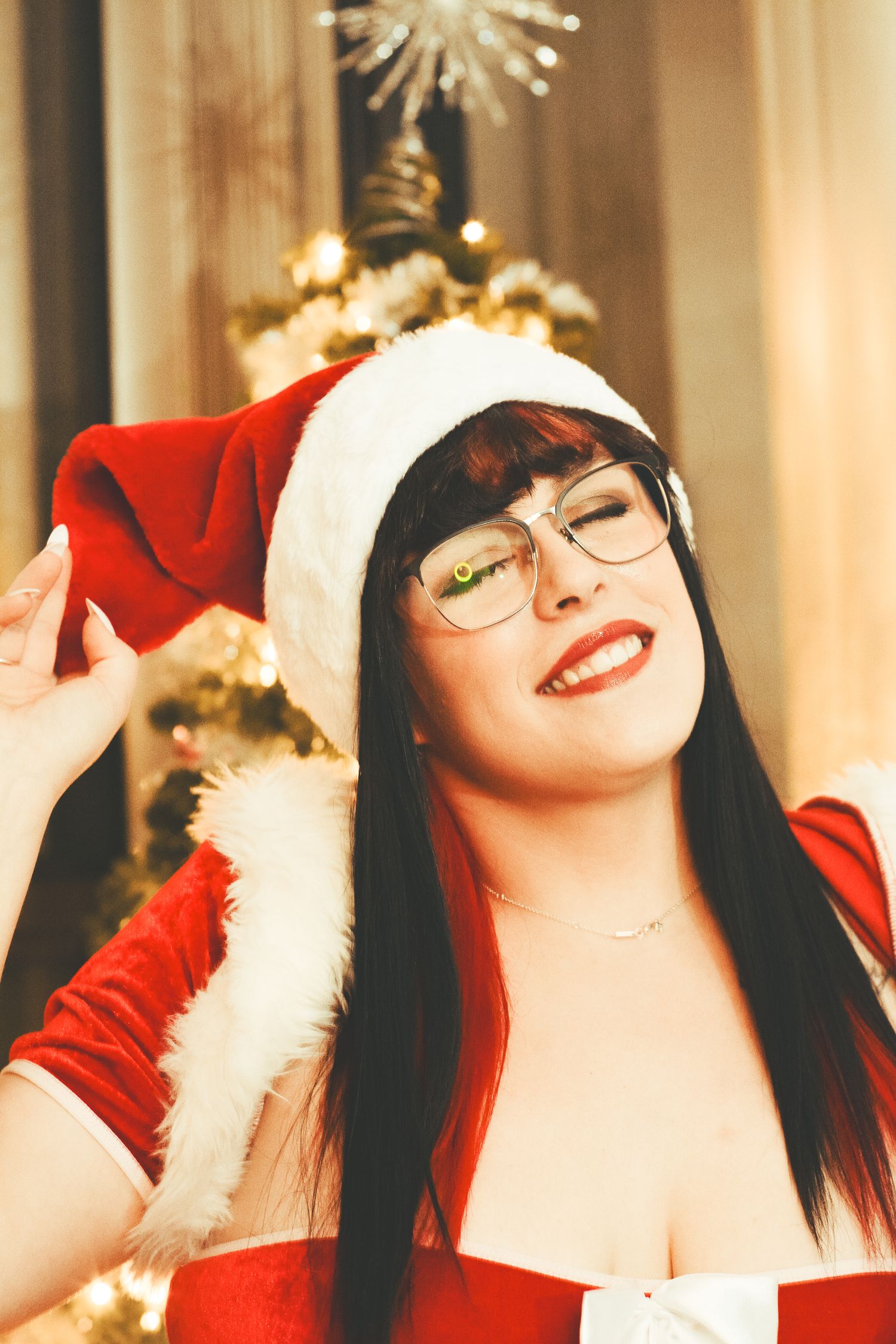 Holiday themed portrait with Christmas decorations and warm ambient lighting.