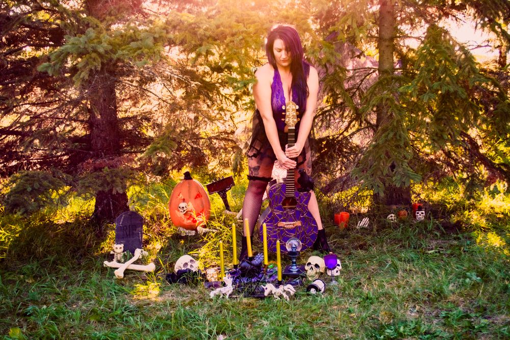 Halloween themed outdoor scene with decorative pumpkins, skulls, and gothic aesthetic elements.