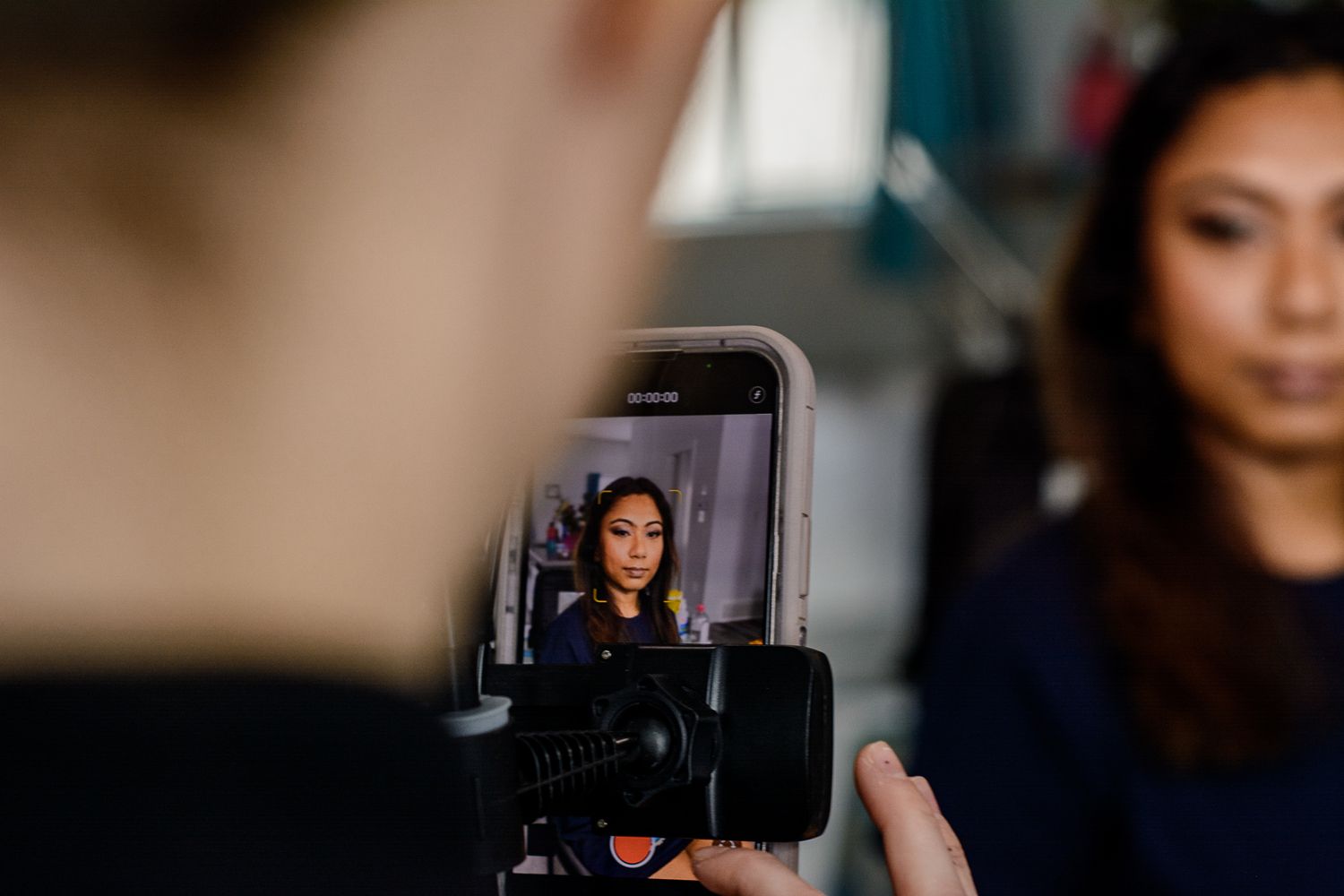 Behind-the-scenes photo shoot setup showing camera display and lighting equipment.