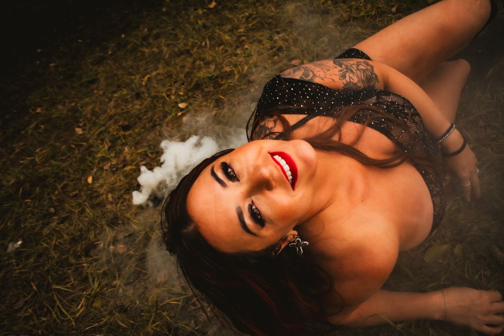 Artistic overhead shot with white smoke effects on natural ground.