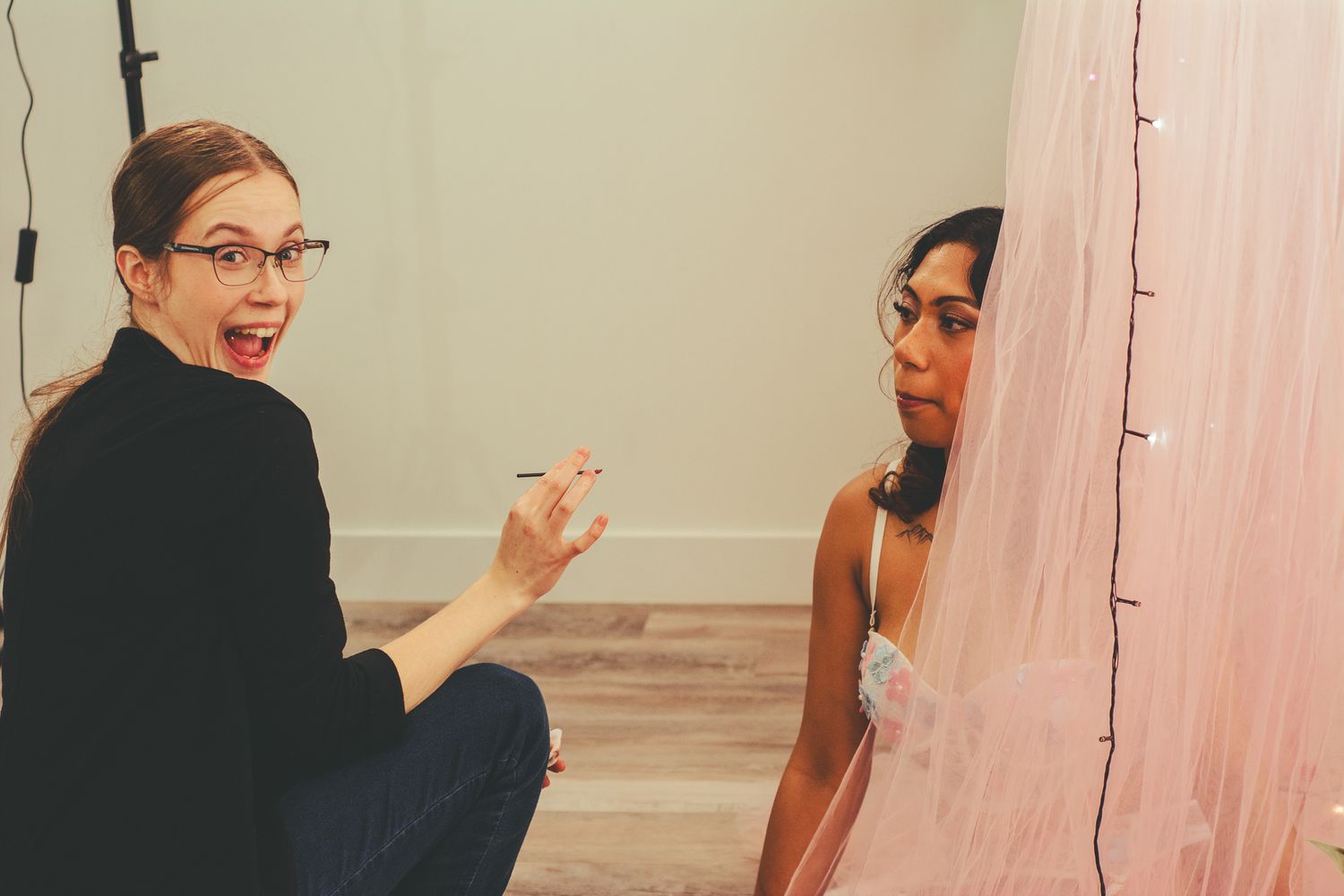 Candid behind-the-scenes moment during a professional photo shoot.