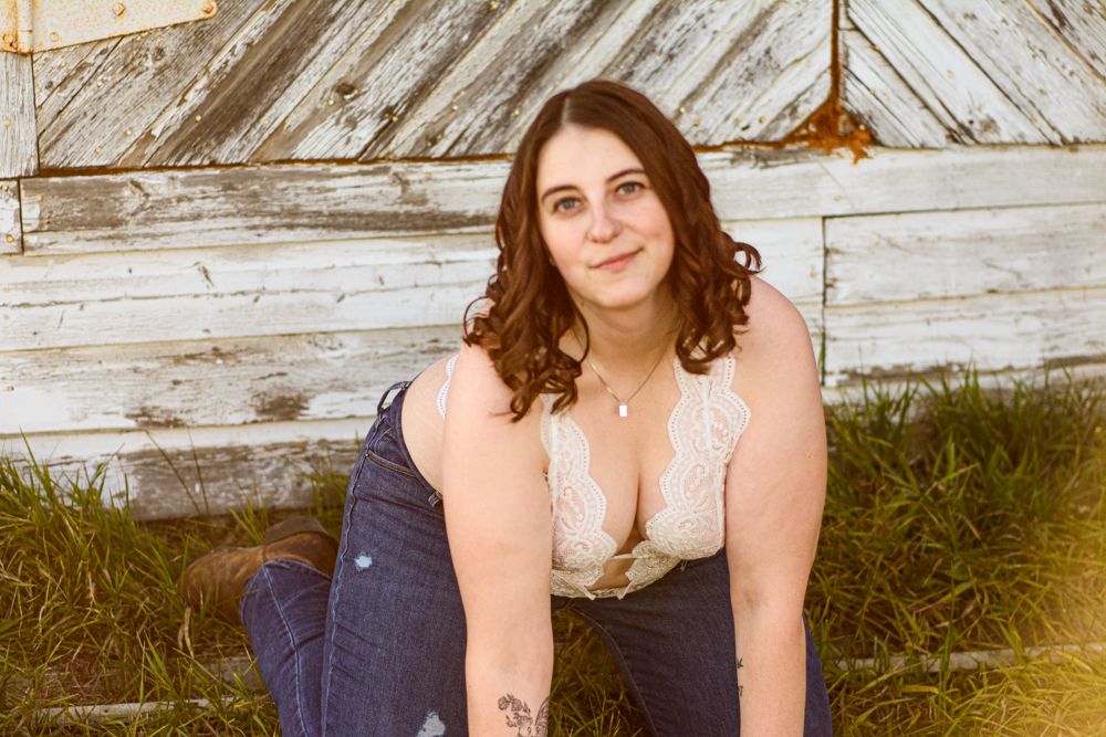 Casual outdoor portrait with vintage wood wall background.