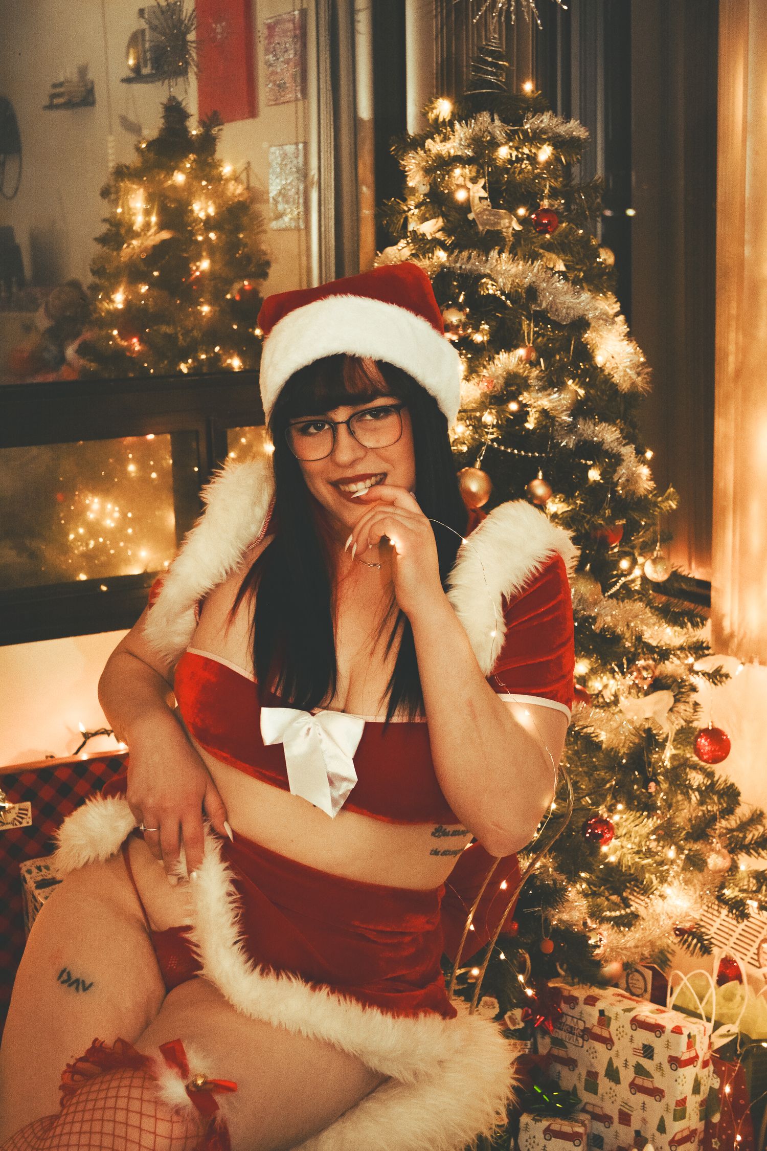 Holiday themed indoor scene with Christmas lights and decorative festive elements.