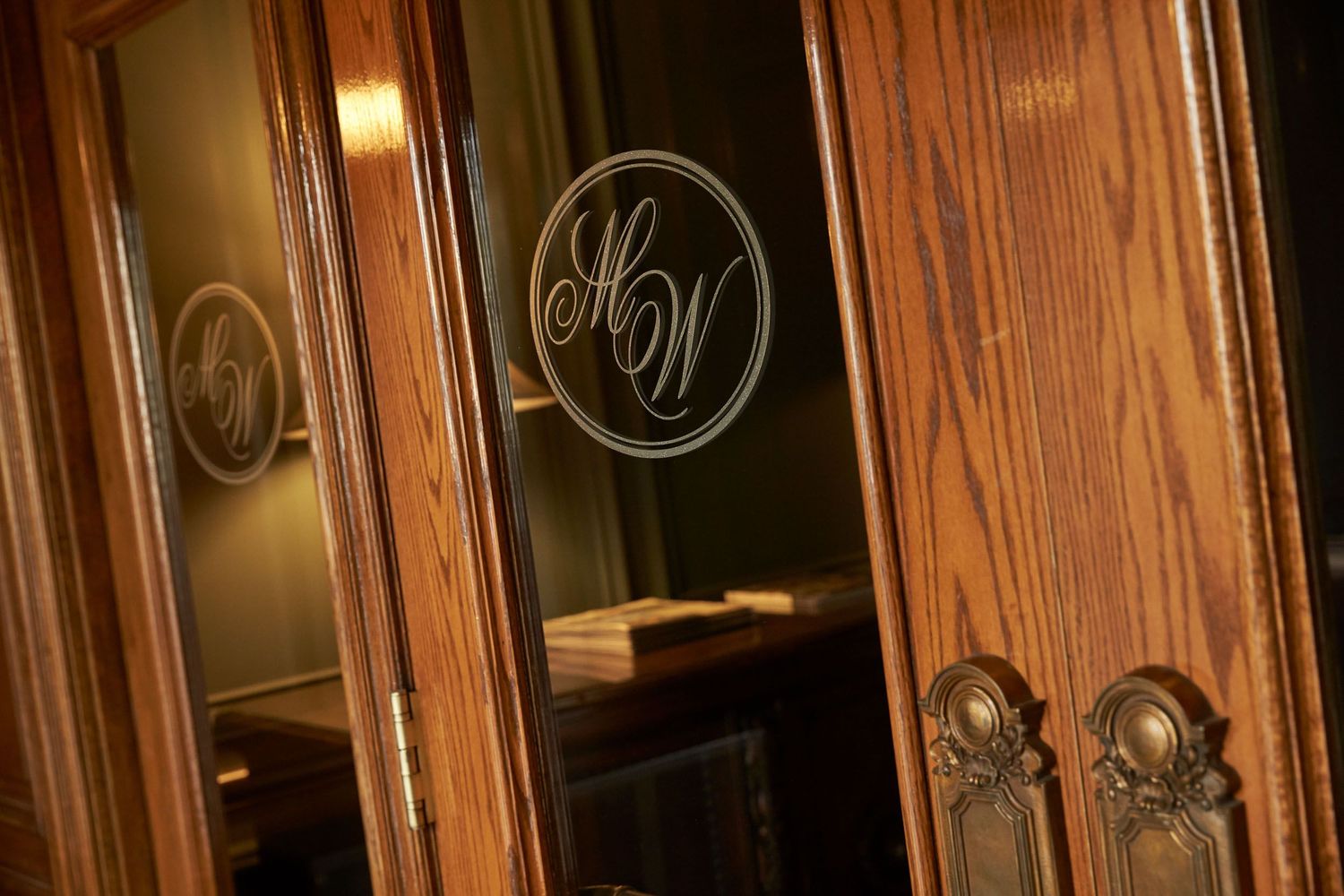 Elegant wooden paneling with ornate details in warm lighting.