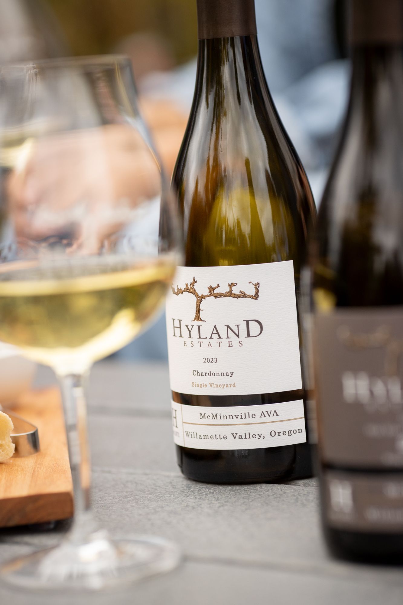 Hyland Estates 2023 Chardonnay McMinnville AVA Willamette Valley Oregon wine bottle beside a full glass.
