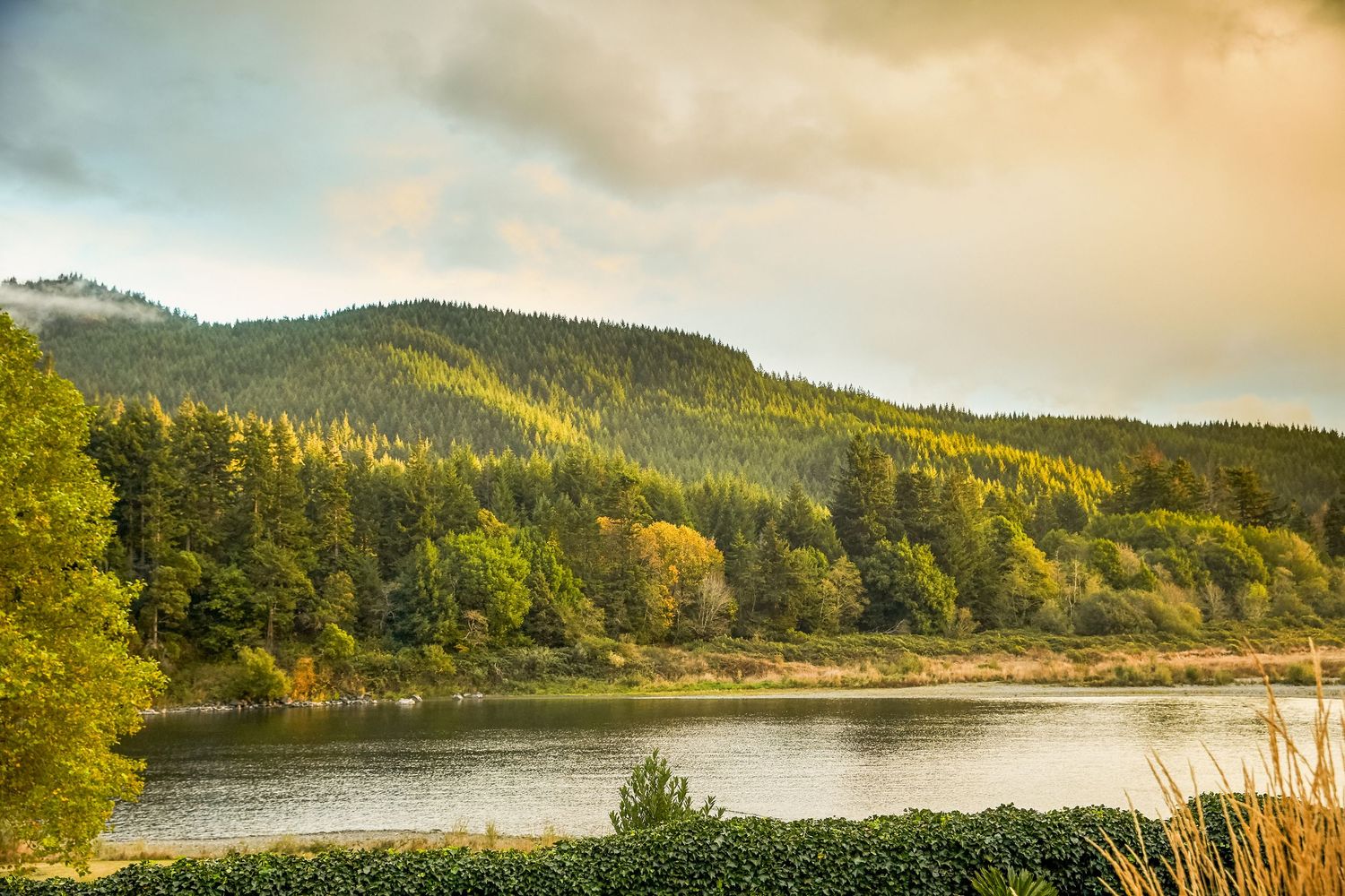 Scenic mountain landscape with lake views at sunset.