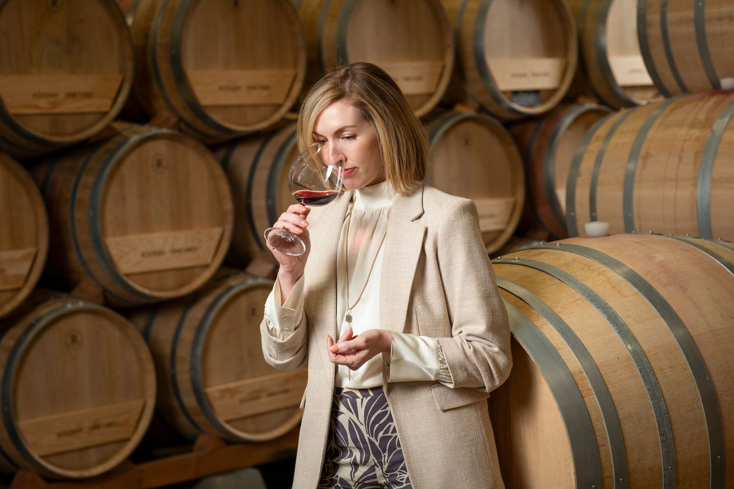 Wine barrels stacked in a traditional cellar storage room.