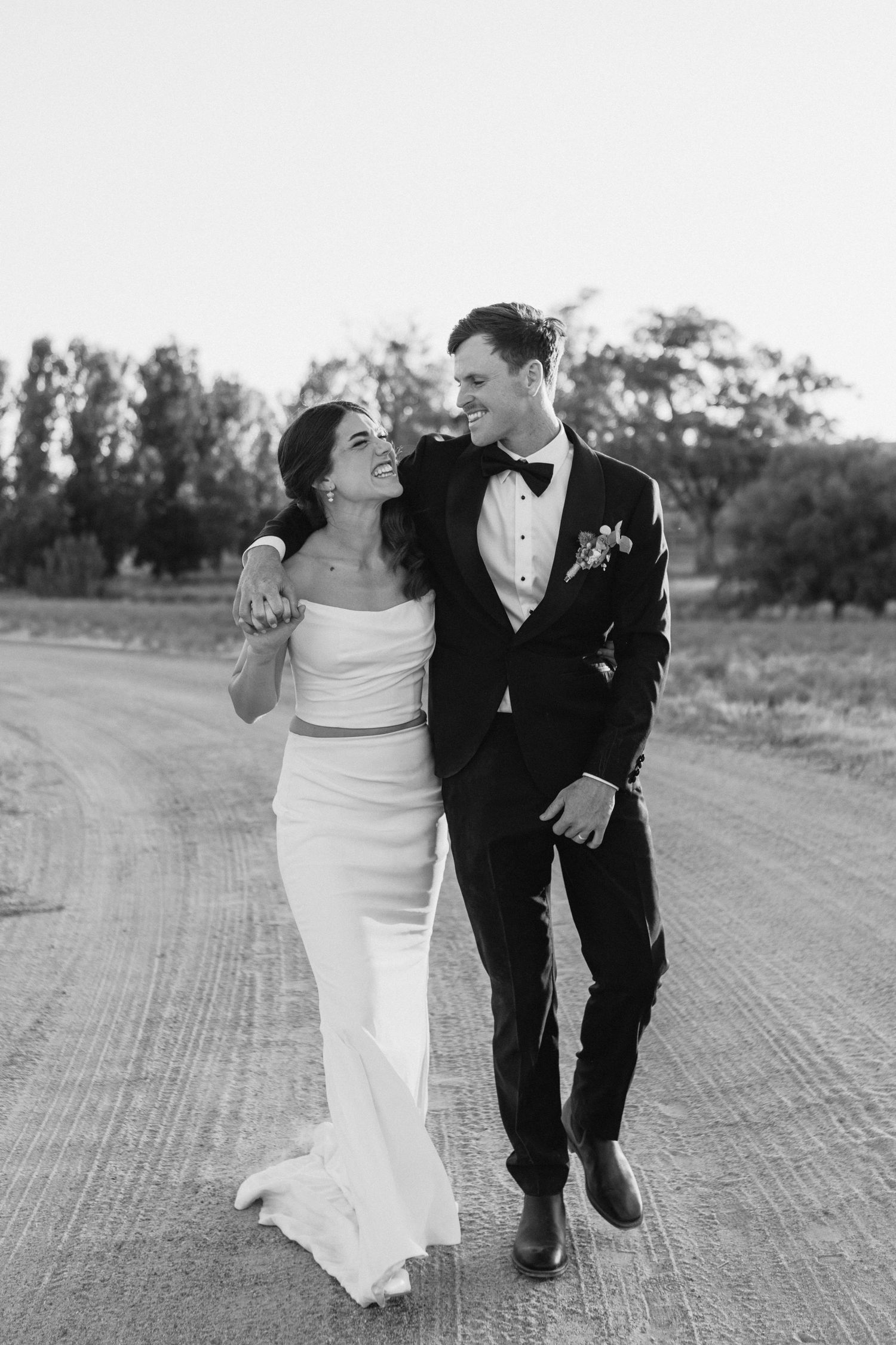 bride and groom walking holding hands at country nsw wedding