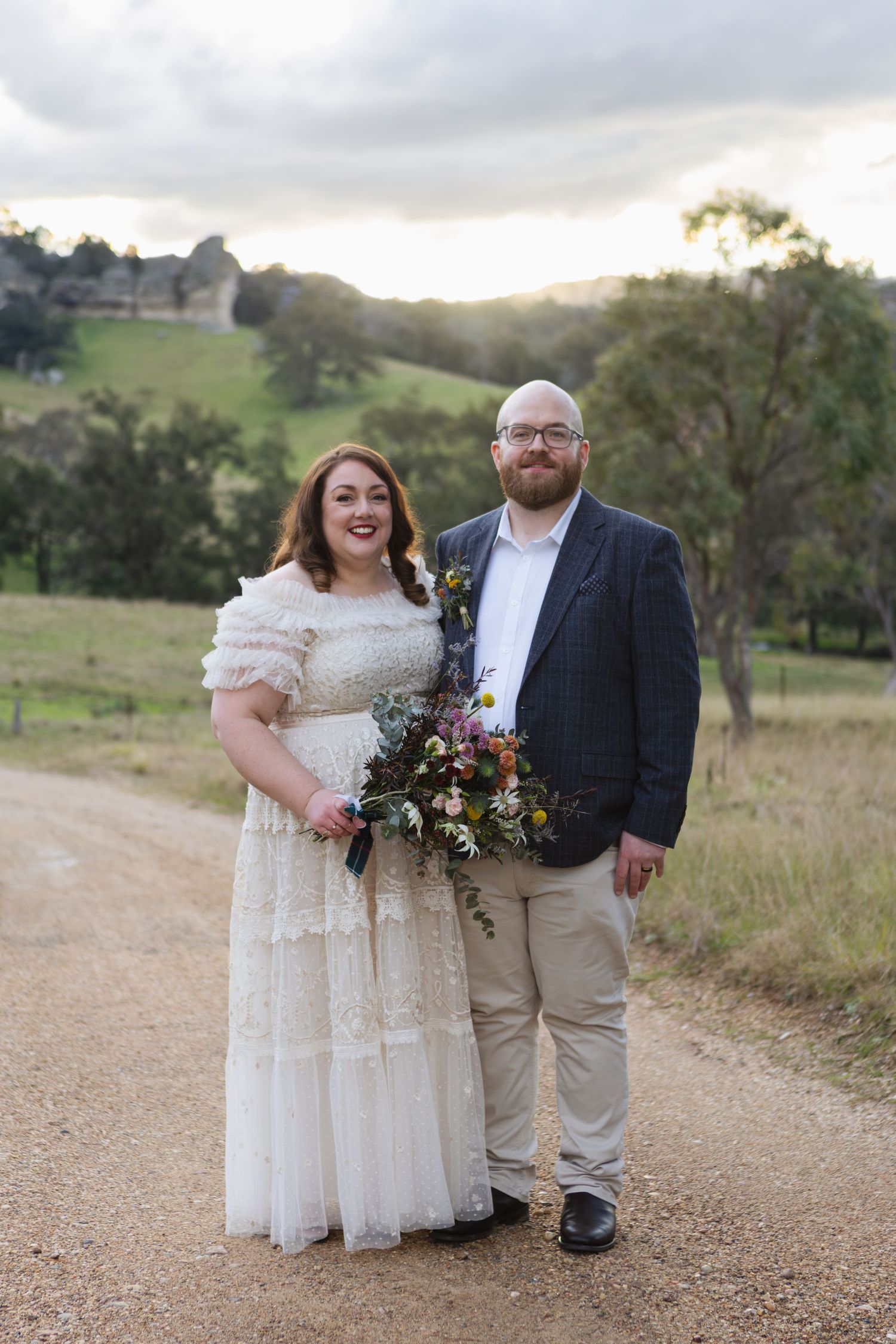 Bride and Groom smiling on country road at Murrurundi country wedding NSW