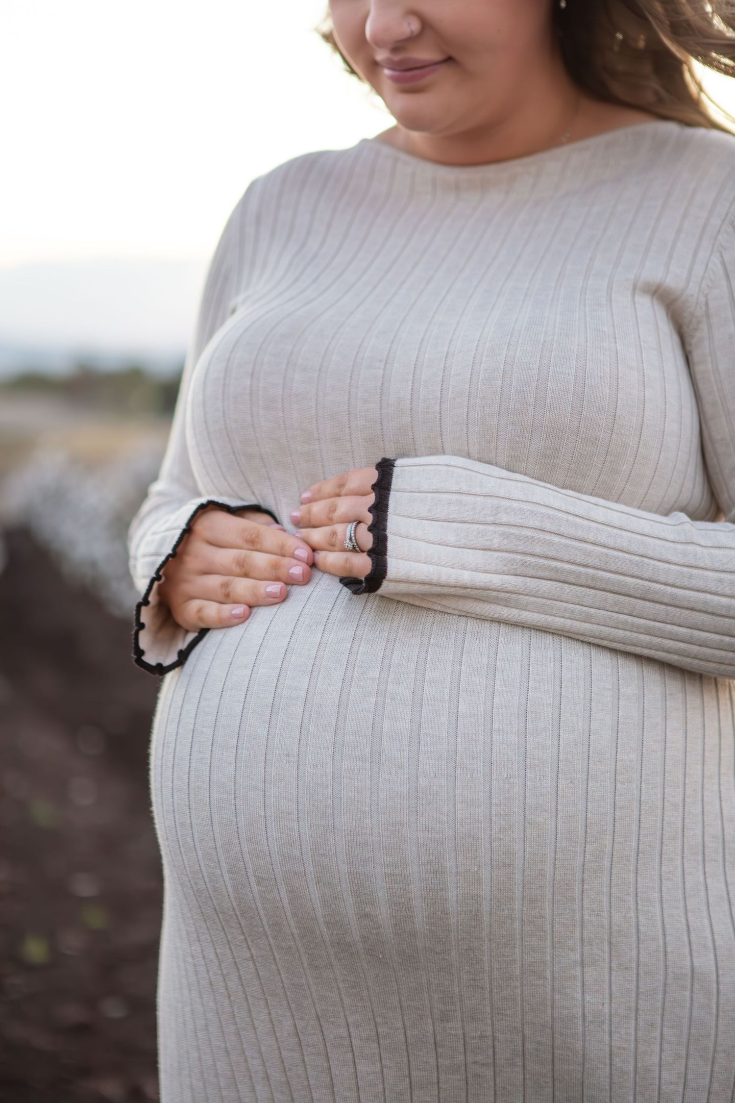 Expecting Mum holding belly during Scone Family Photoshoot