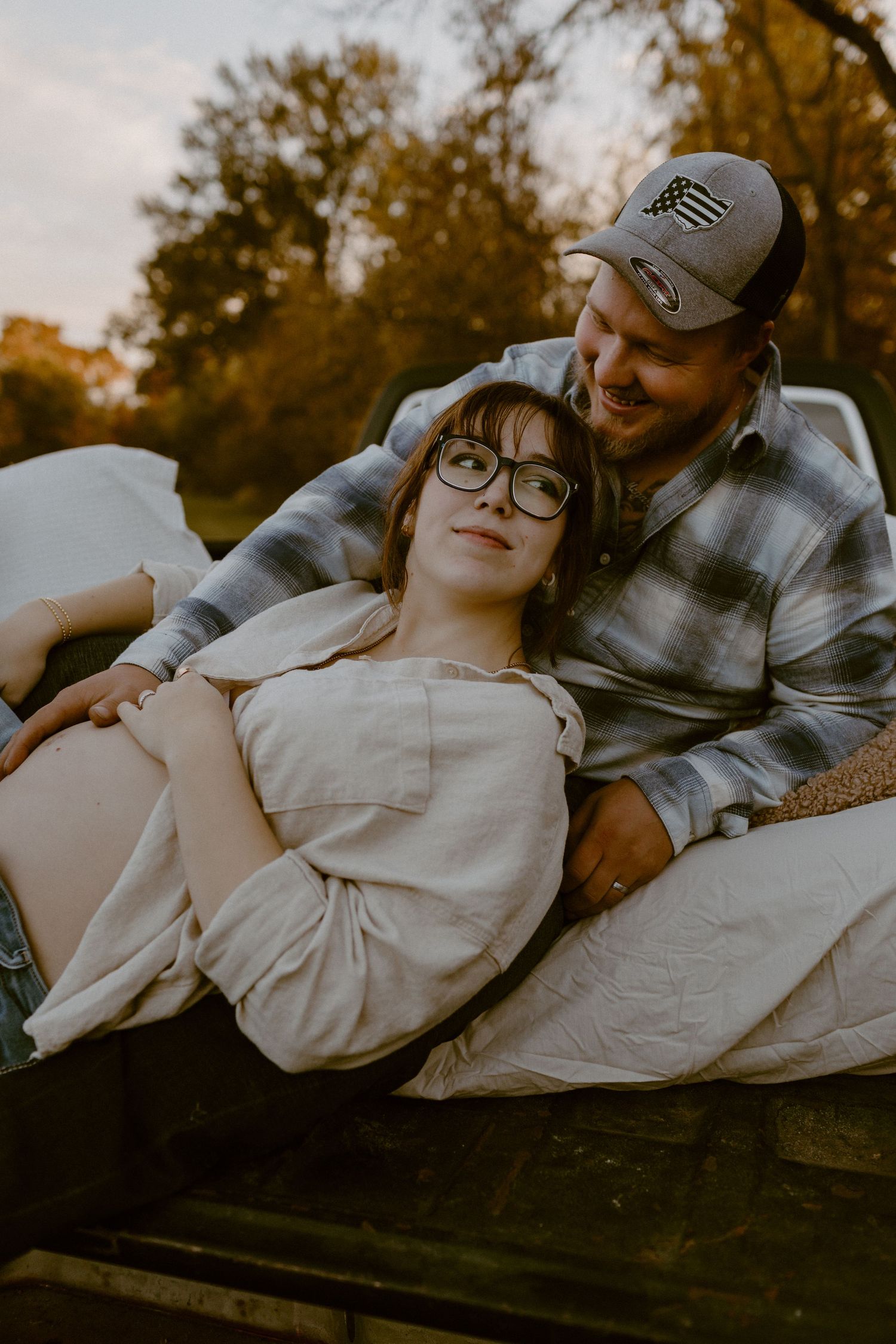 Couple embrace during their unique maternity session in Ana, OH. Photographed by Vicci Photo of Dayton OH
