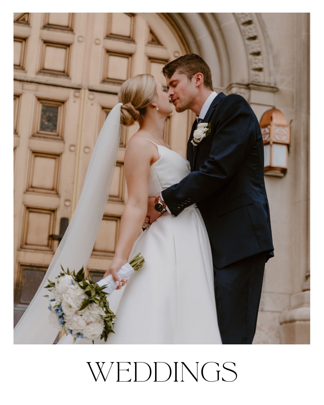 Bride and groom kiss in front of a church, located in Cincinnati, Ohio.