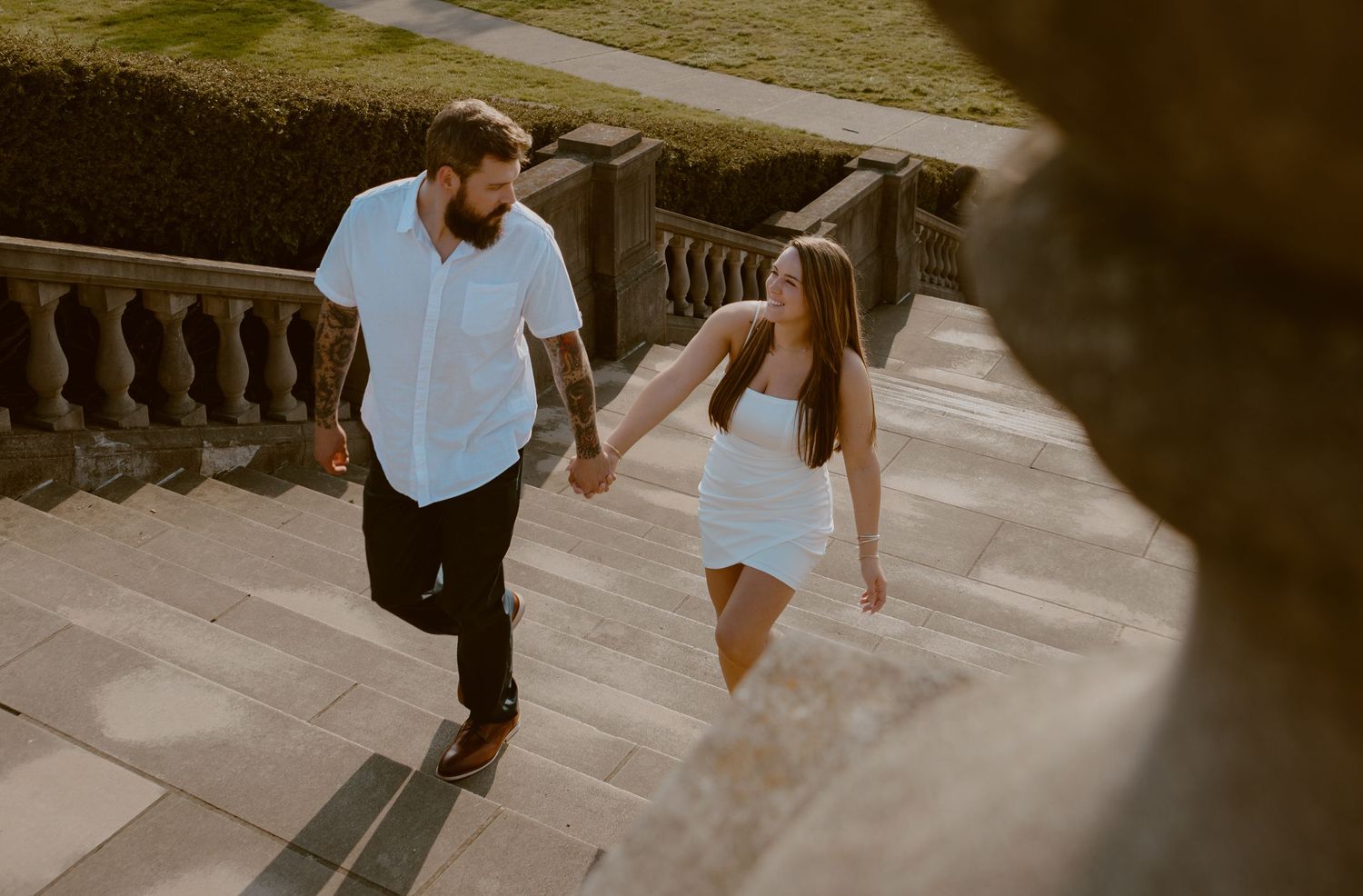 Couple walks up the steps of Ault Park in Cincinnati, OH. Photographed by Vicci Photo of Dayton, OH.