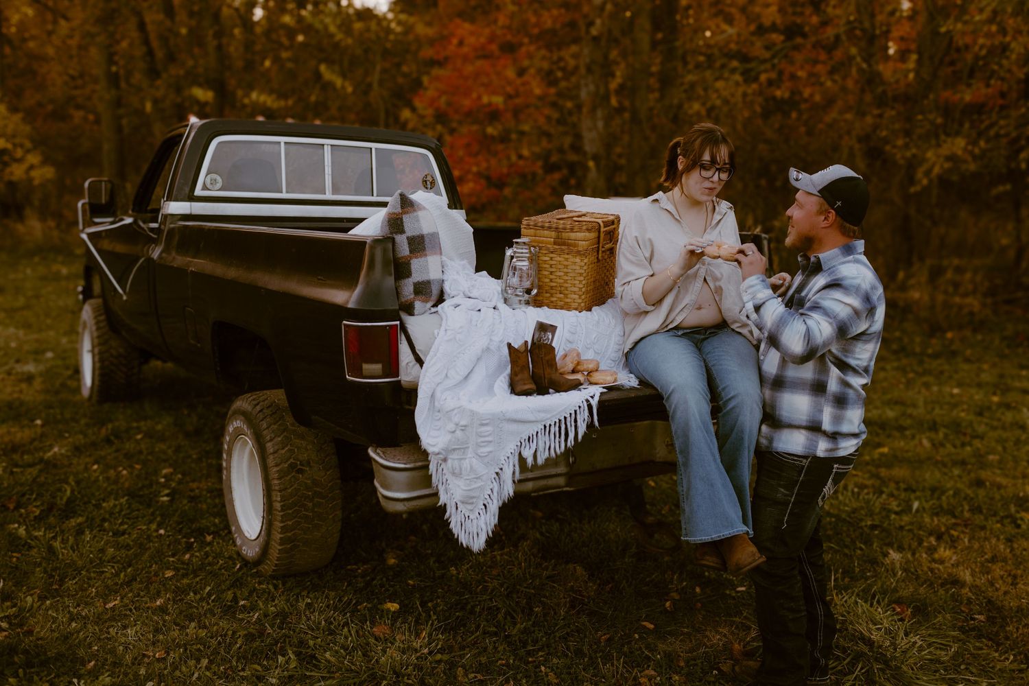 Couple enjoy donuts during their unique maternity session in Ana, OH. Photographed by Vicci Photo of Dayton OH