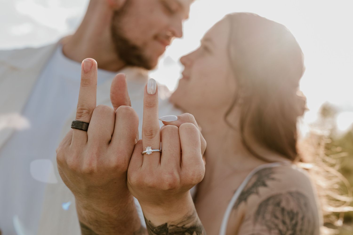 Newly engaged couple show off their rings after a surprise proposal in Miamisburg, OH. Photographed by Vicci Photo of Dayton OH