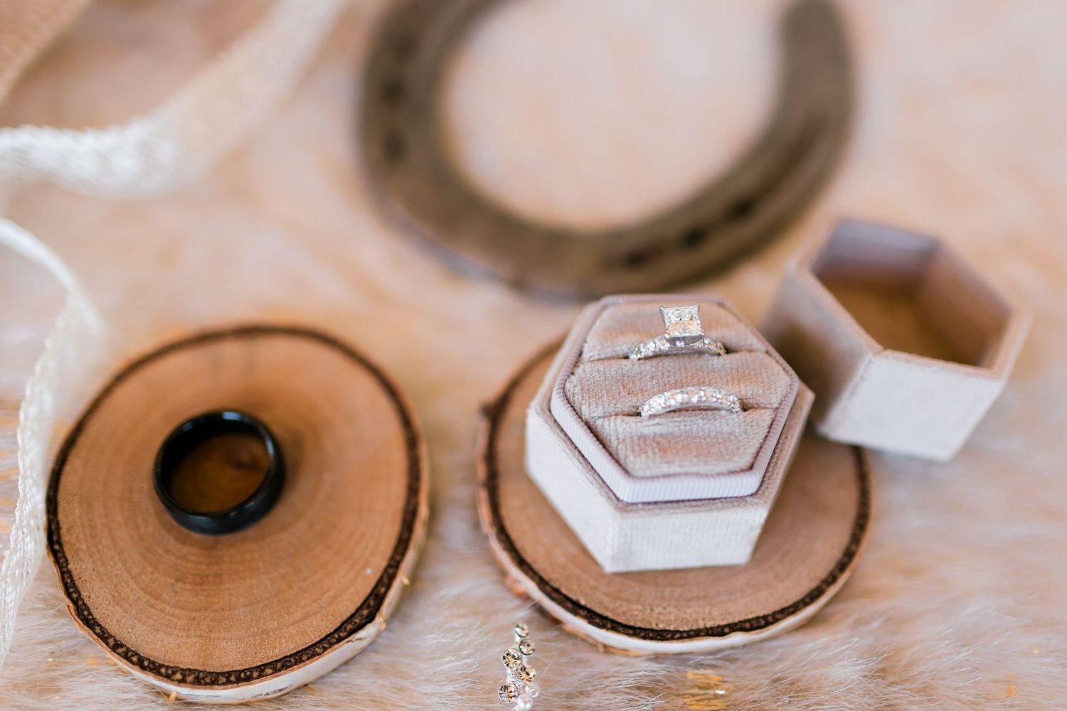 Wooden earring making process showing stages of cutting, drilling, and finishing circular shapes on a workbench.
