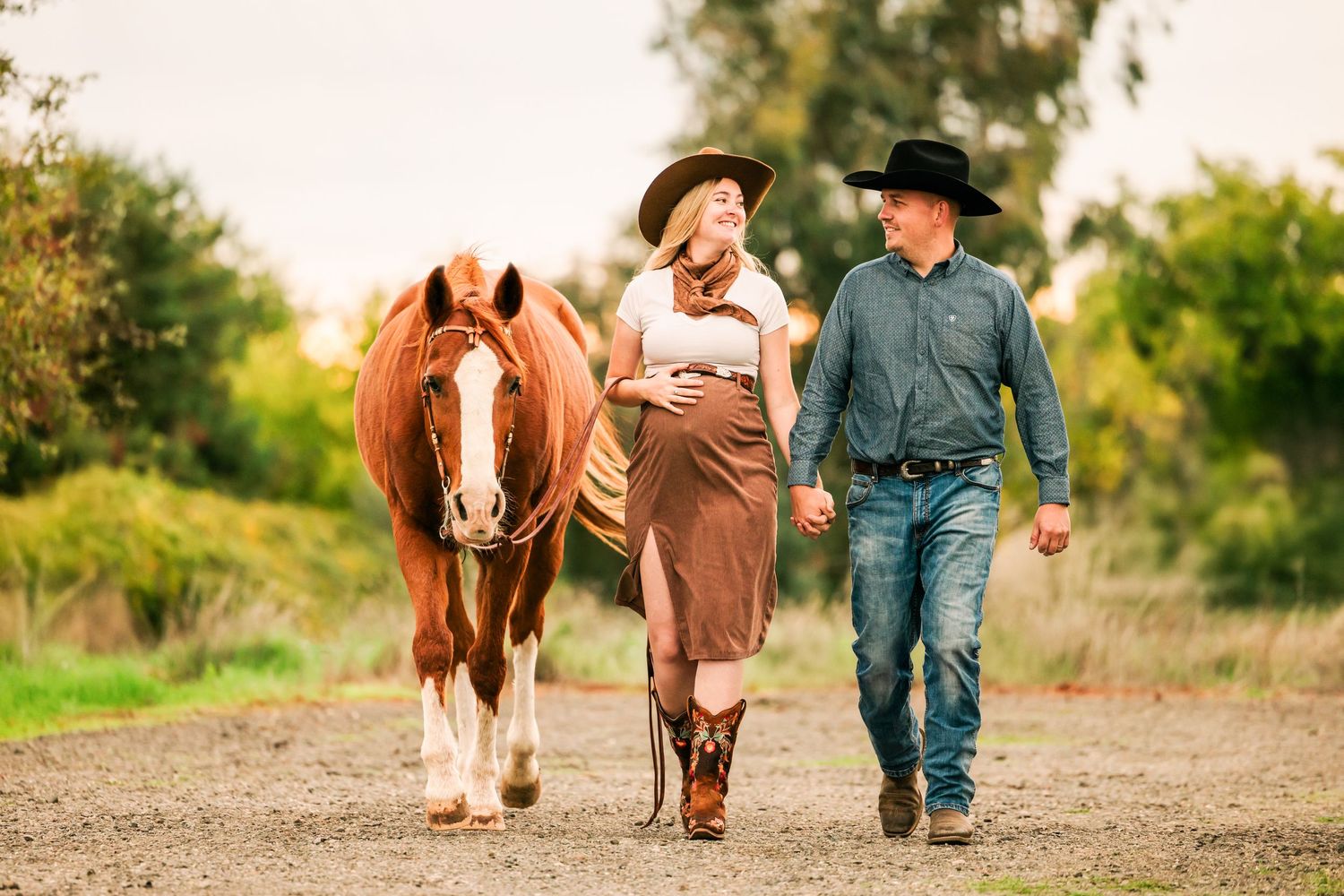 A series of connected photos showing a couple walking with their brown and white pony along a dirt path at sunset.