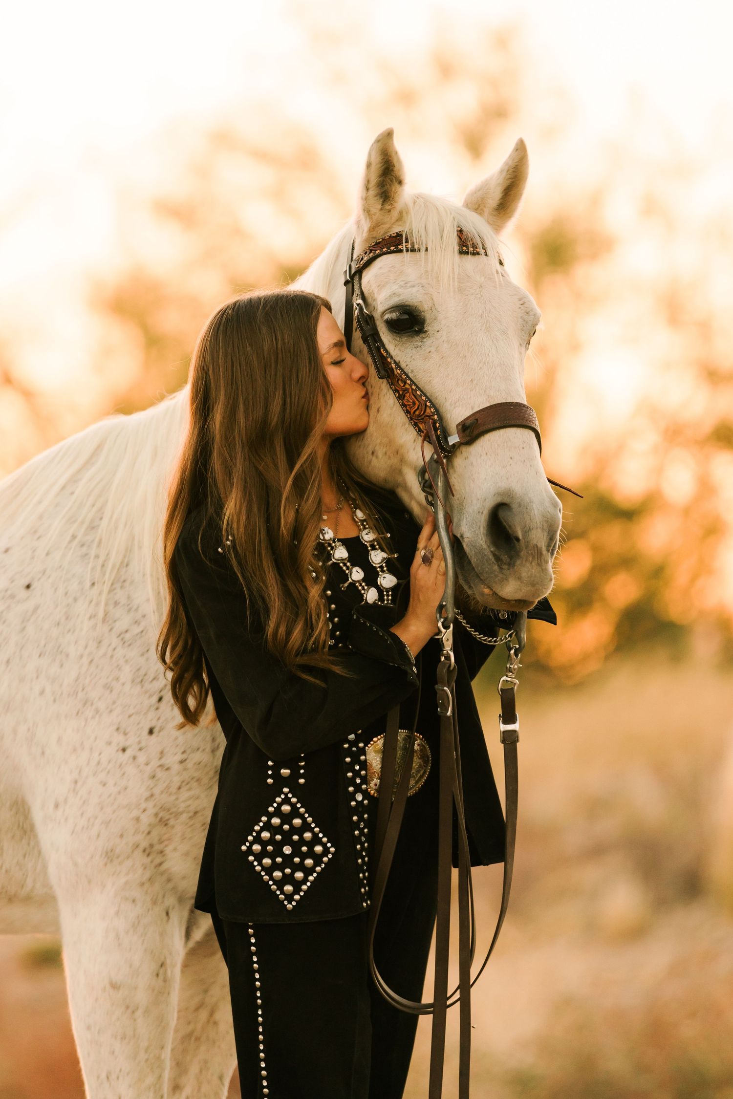 Woman and kissing horse while posing for Northern California Horse Photographer in Bay Area
