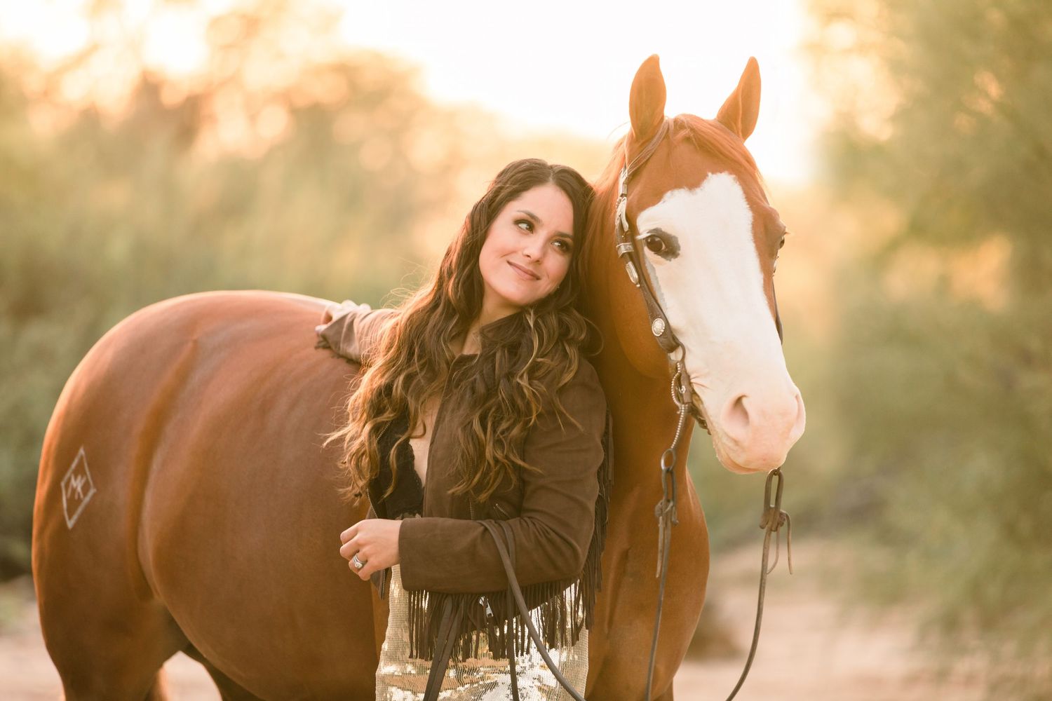 Girl looking into the eyes of her horse while posing for Northern California Equine Photographer Lauren Wagner in Sacramento, CA