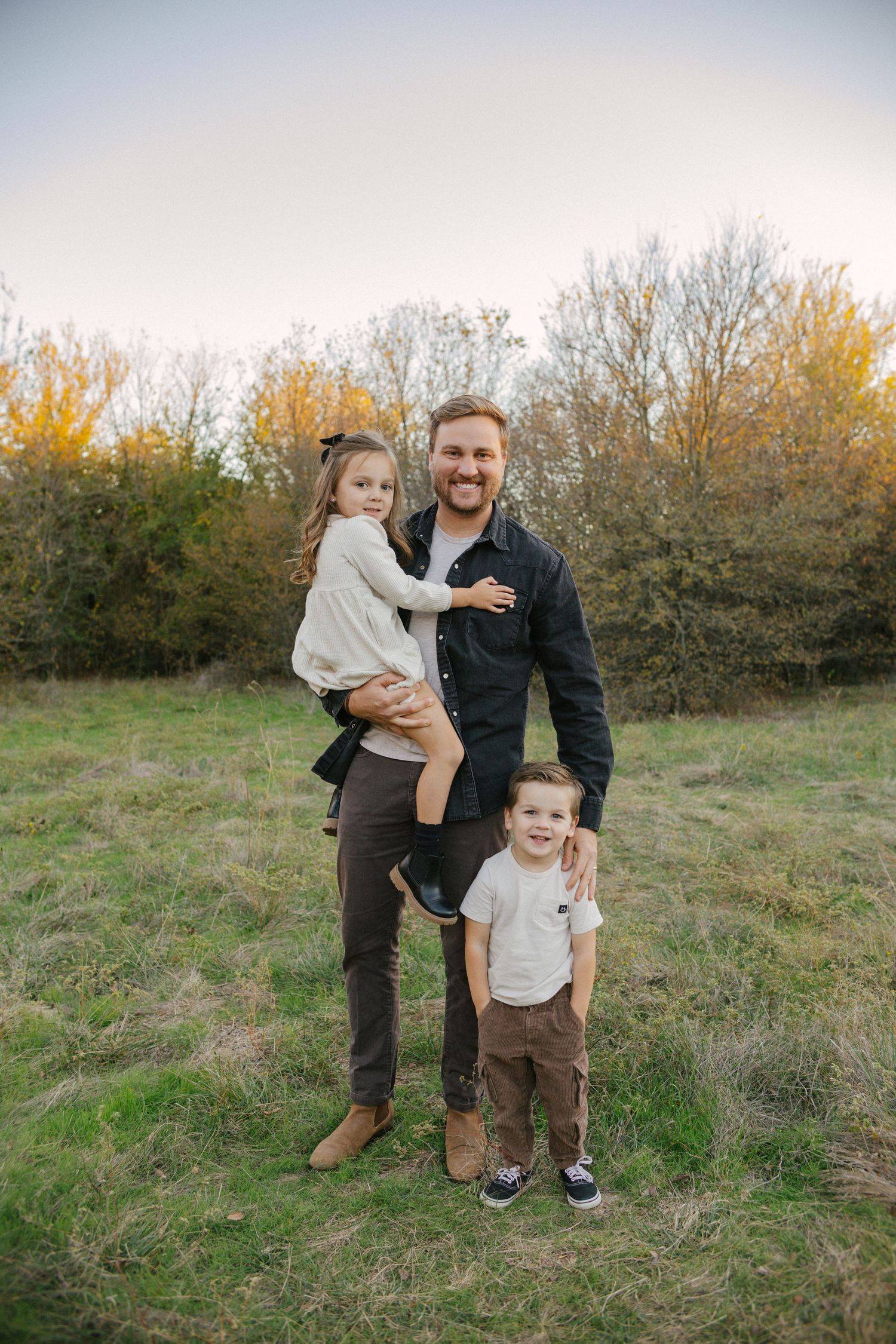Dad with kids in Argyle, tx field
