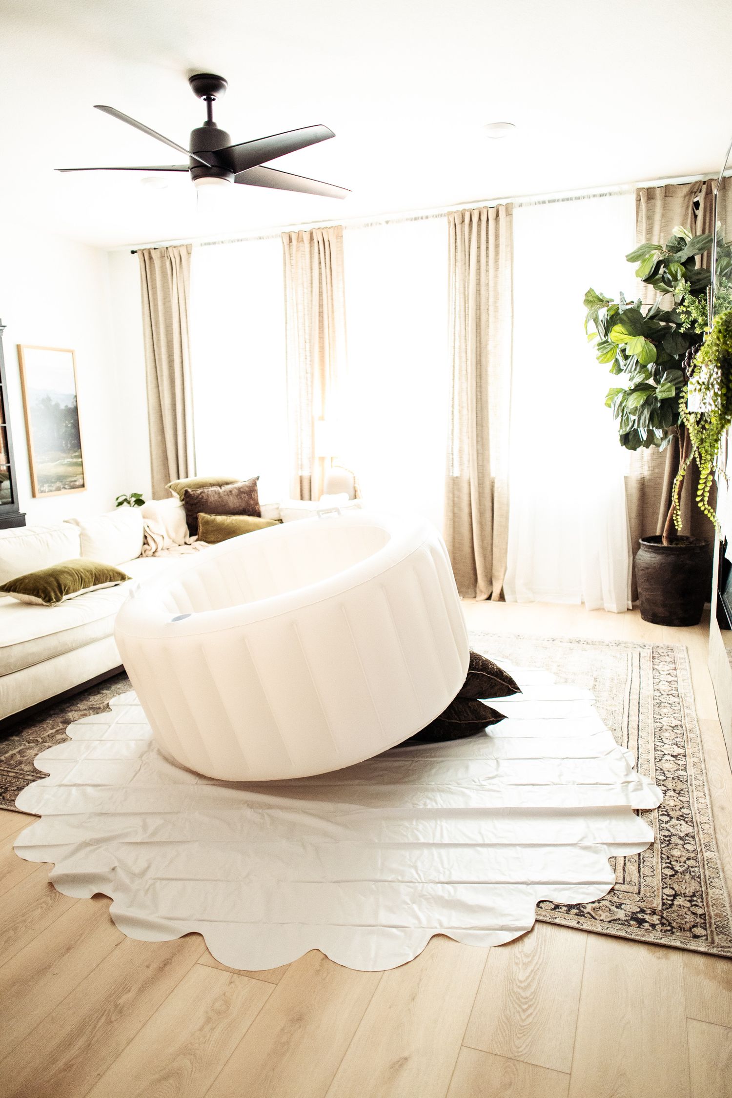 Photograph of a calm and serine home birth with soft sunlight filtering in the living room near Mechanicsburg PA in Dauphin County.