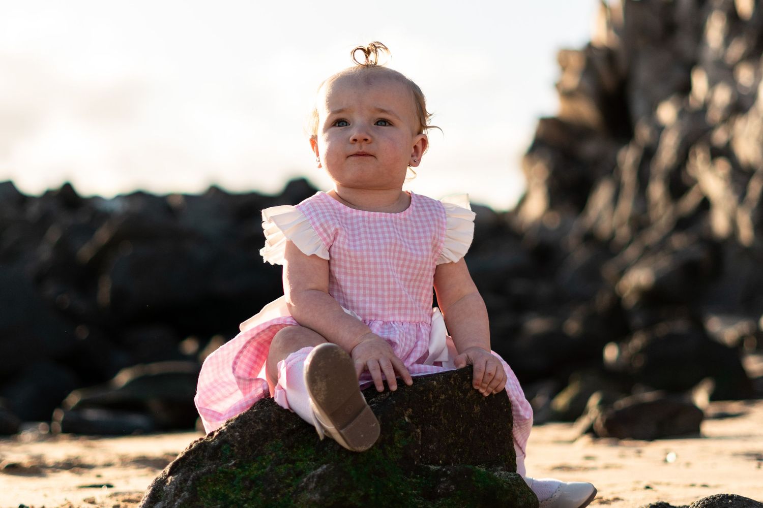 Children playing on black sand beach during family 
photo session, Lanzarote Canary Islands