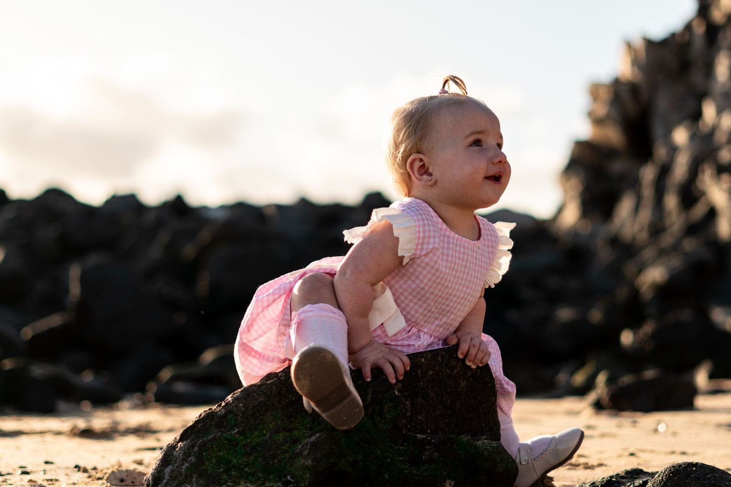 Children playing on black sand beach during family 
photo session, Lanzarote Canary Islands