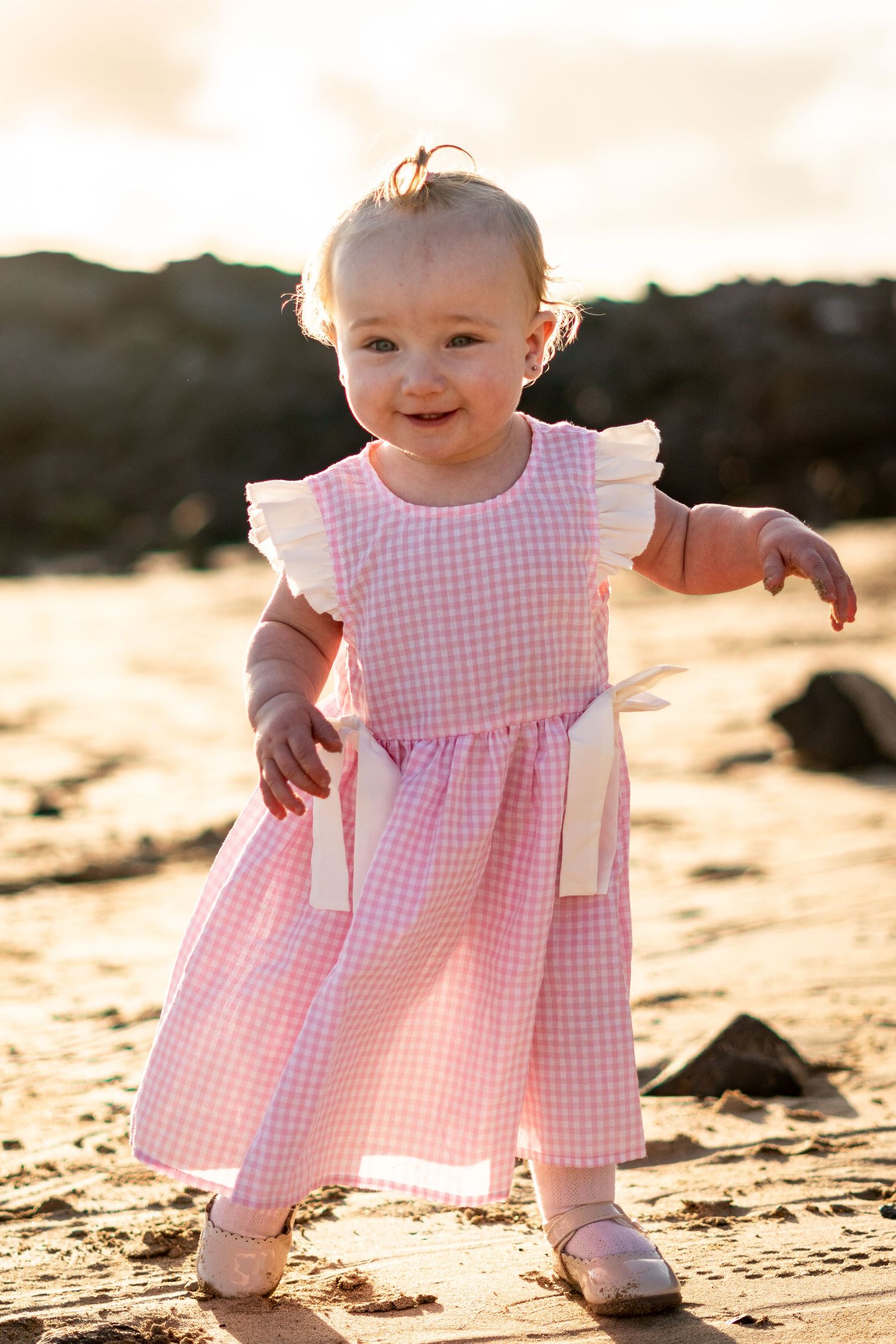 Children playing on black sand beach during family 
photo session, Lanzarote Canary Islands