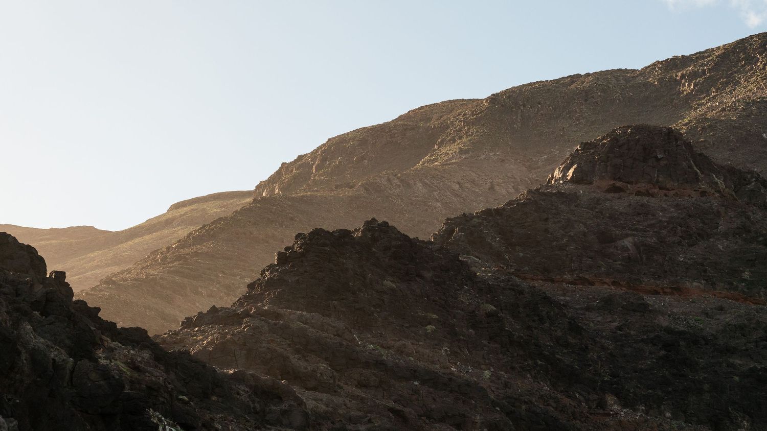Black sand volcanic beach Lanzarote dramatic 
landscape — cinematic photography Del Puerto Creative