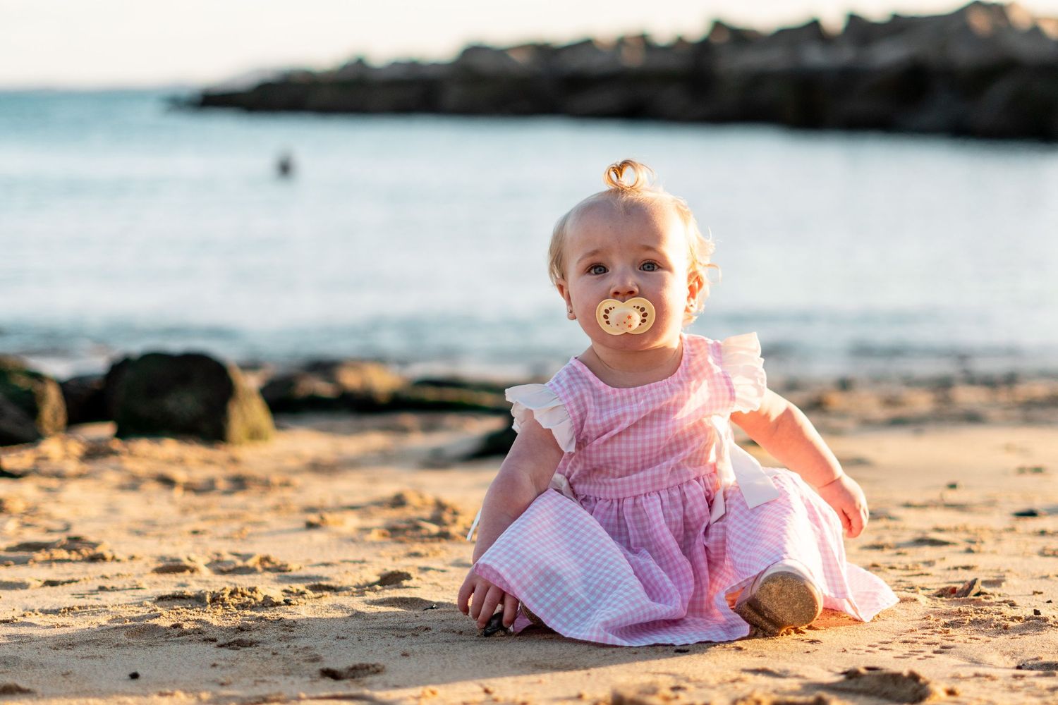 Children playing on black sand beach during family 
photo session, Lanzarote Canary Islands