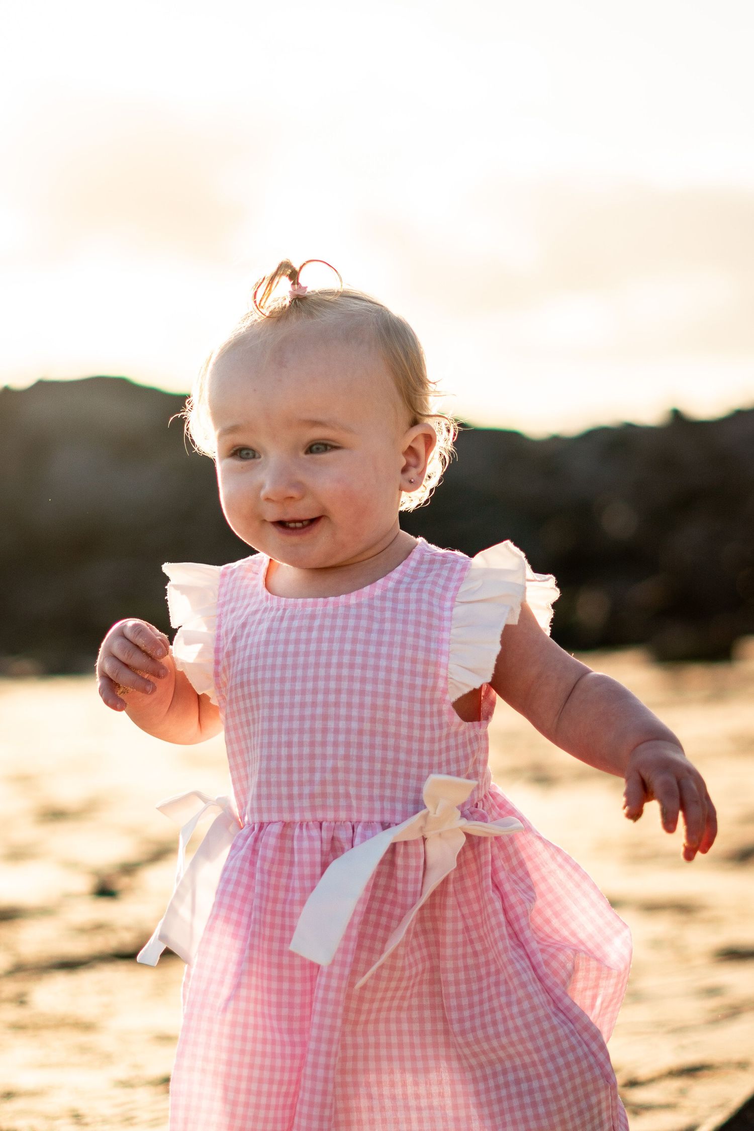 Children playing on black sand beach during family 
photo session, Lanzarote Canary Islands