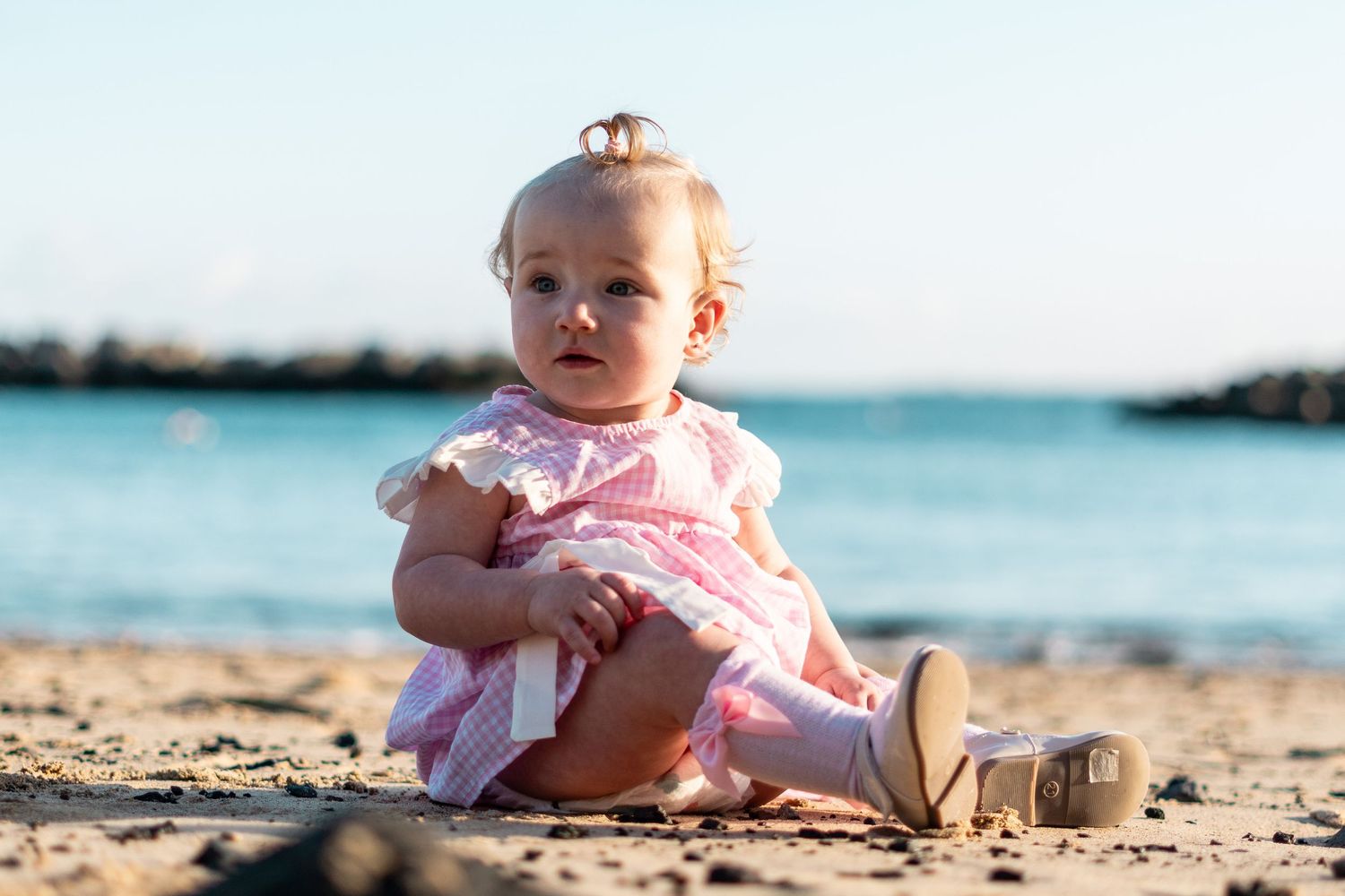 Children playing on black sand beach during family 
photo session, Lanzarote Canary Islands
