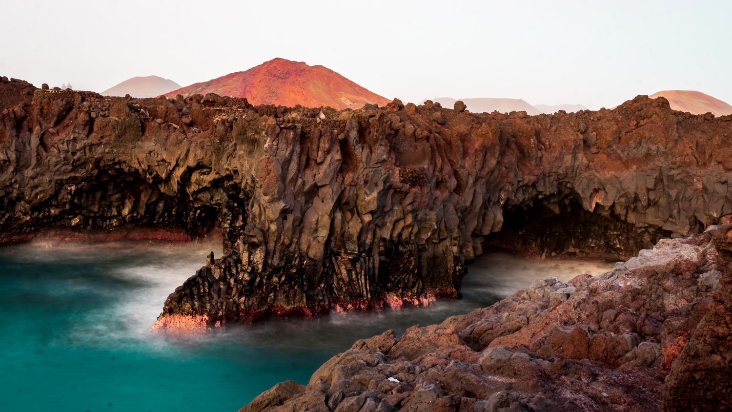 Los Hervideros lava coastline long exposure 
photography Lanzarote — dramatic seascape