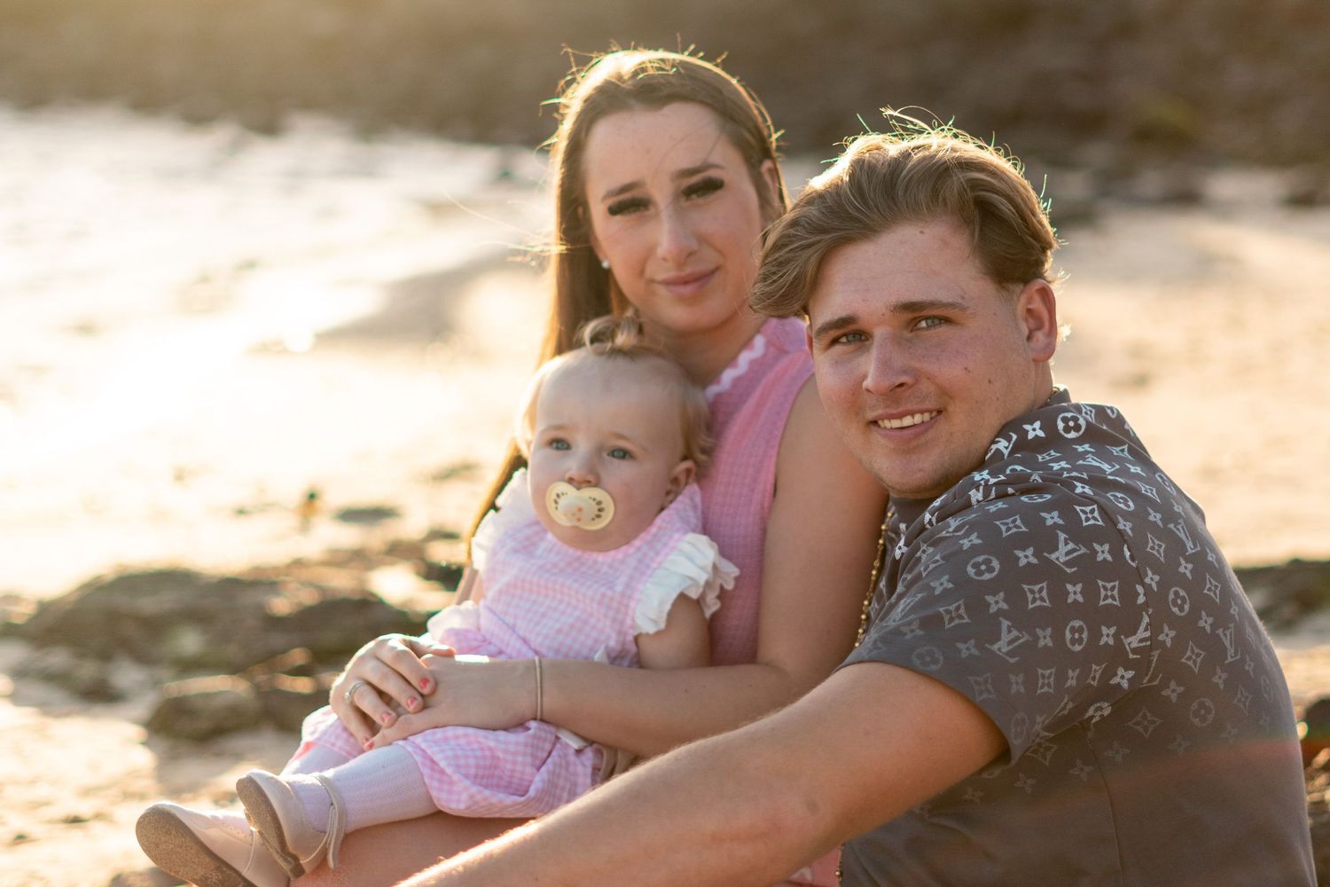 Parents with children portrait on volcanic coastline 
Lanzarote — golden hour family photography