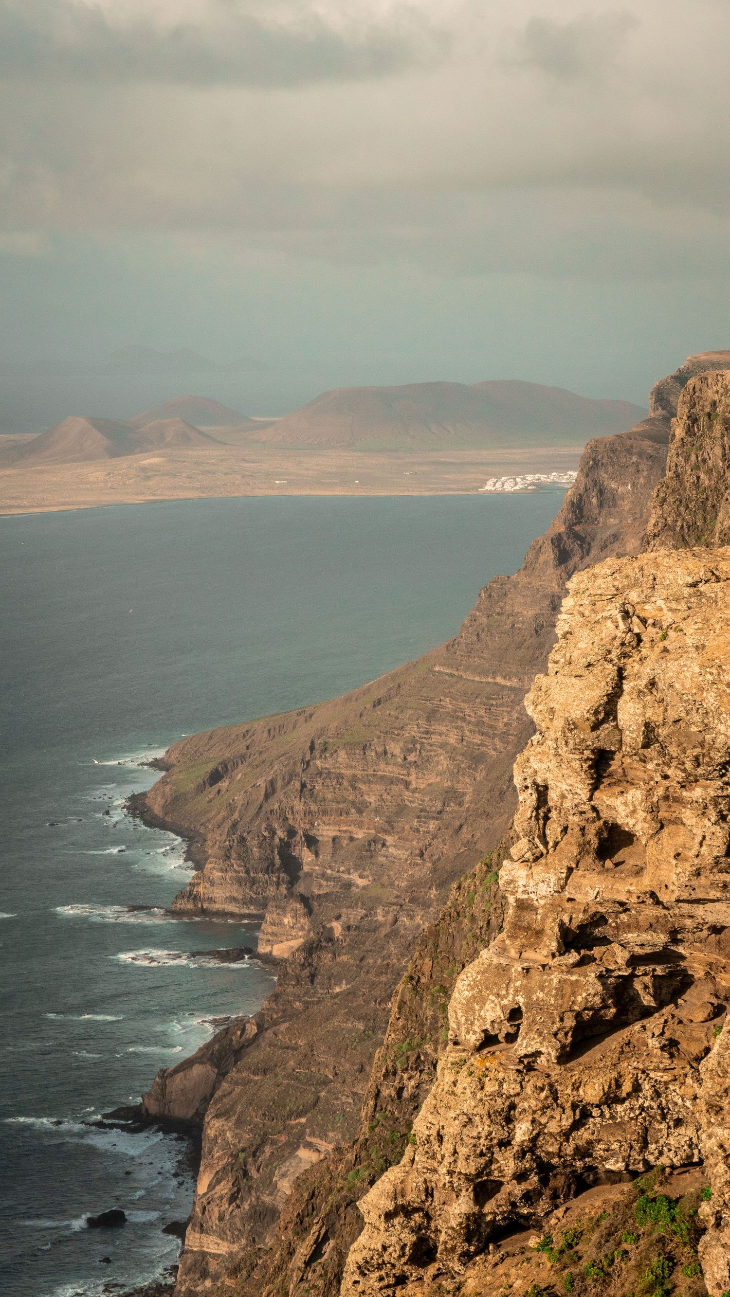 Black sand volcanic beach Lanzarote dramatic 
landscape — cinematic photography Del Puerto Creative