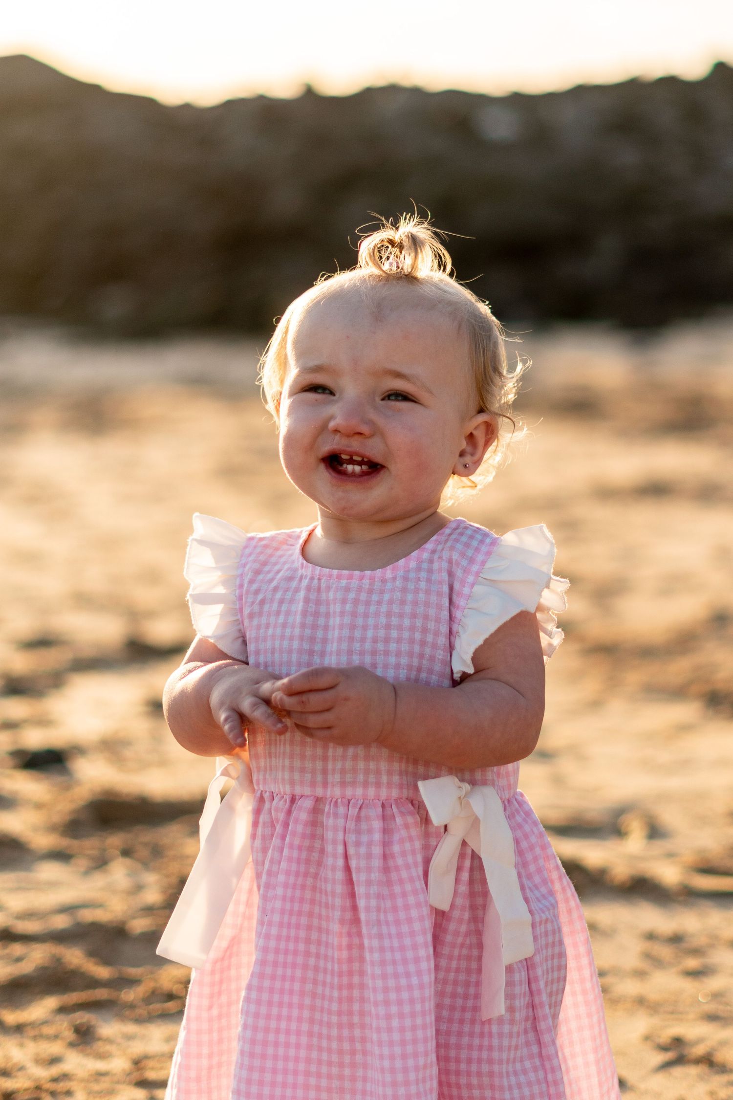 Children playing on black sand beach during family 
photo session, Lanzarote Canary Islands