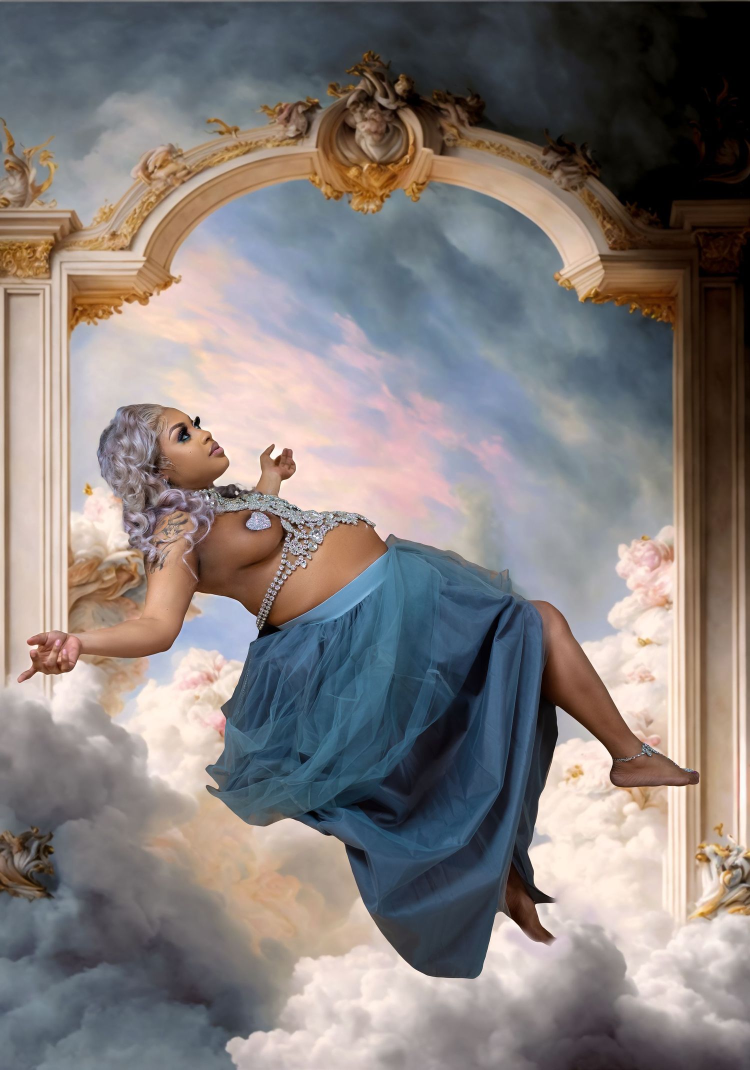 Woman in blue skirt and beaded top posing in dreamy cloud baroque art setting.