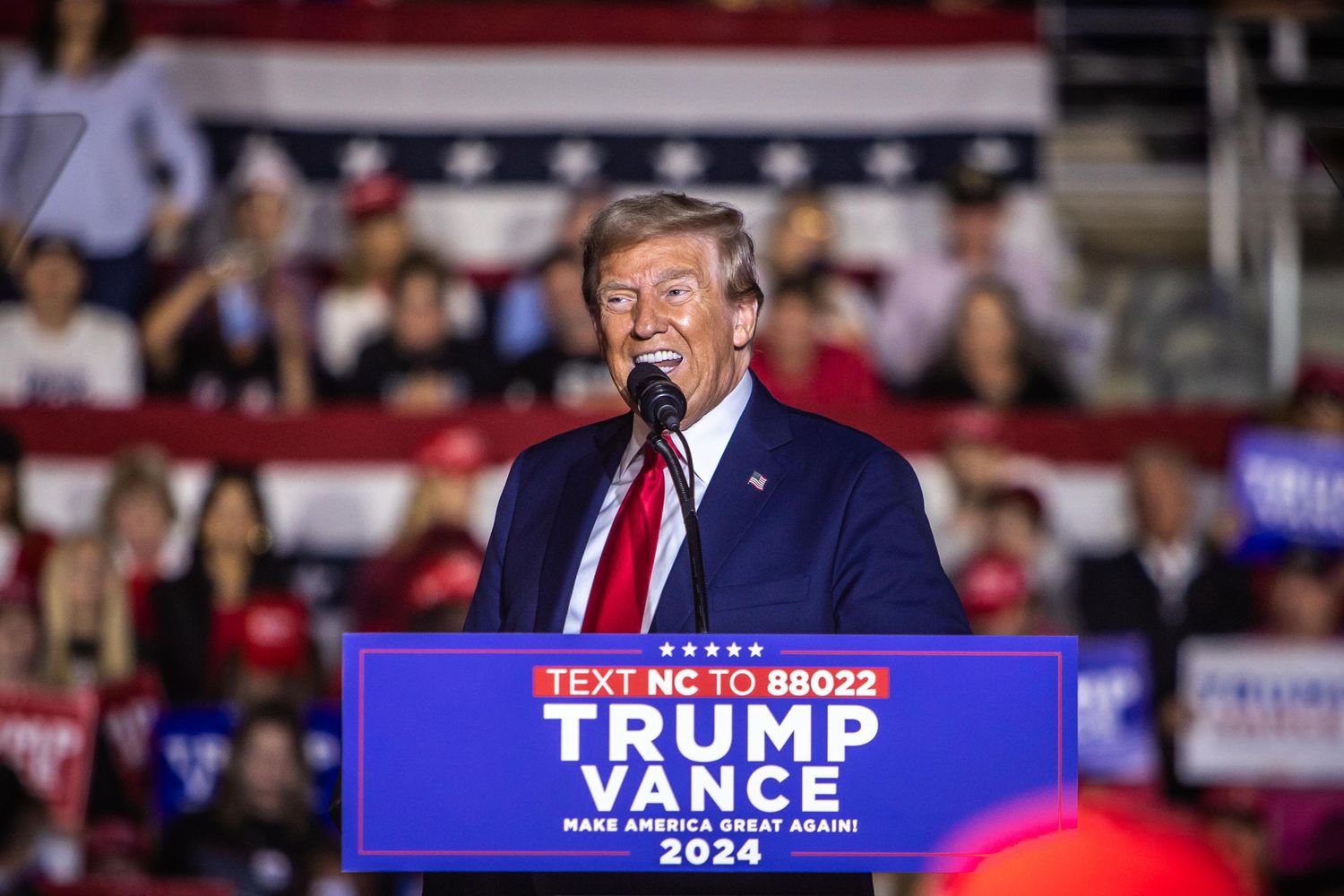 Donald Trump smiles while speaking at a Trump Vance 2024 Make America Great Again rally in North Carolina.