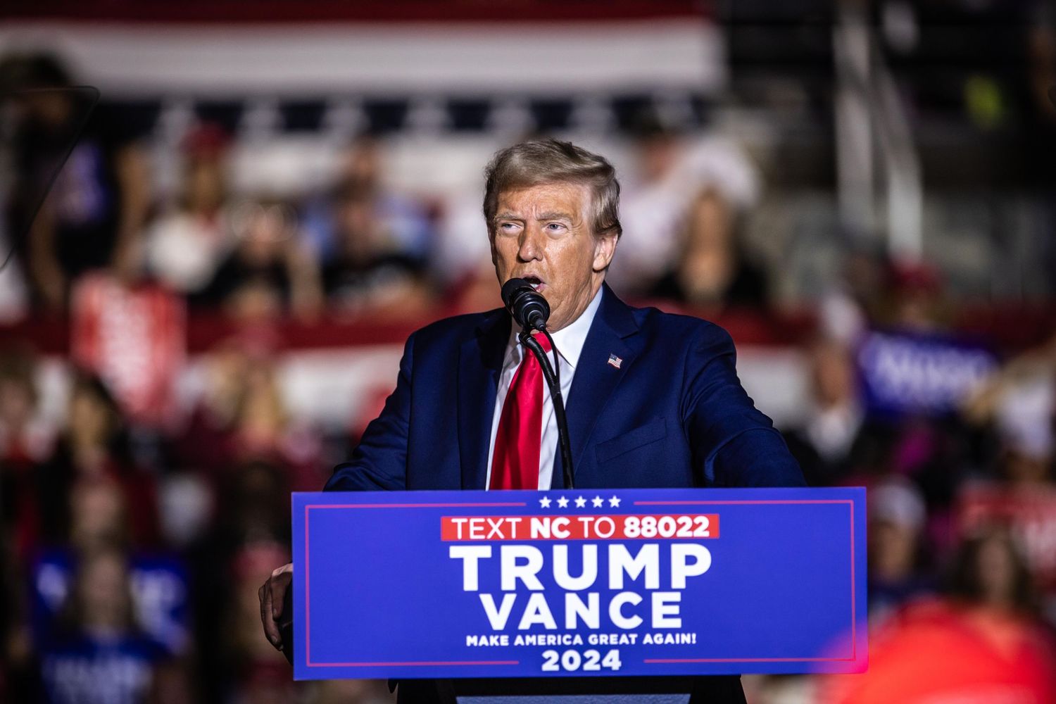 Donald Trump speaks at a Trump Vance 2024 campaign rally in North Carolina at a packed indoor venue.