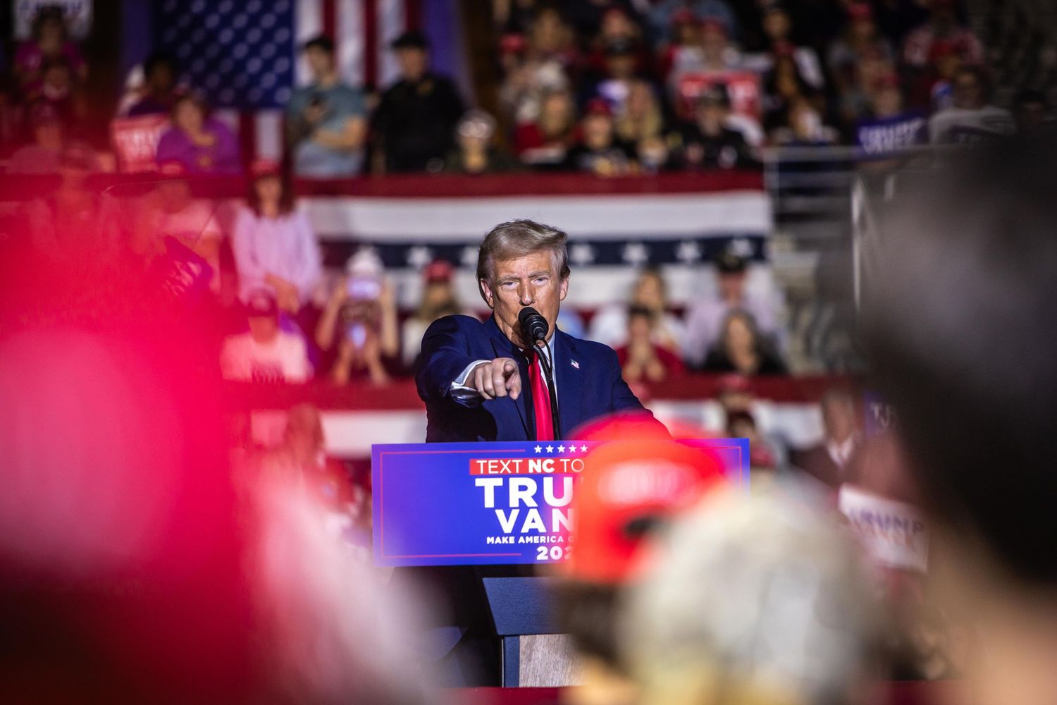 Donald Trump points to the crowd at an energetic Trump Vance 2024 campaign rally in North Carolina.