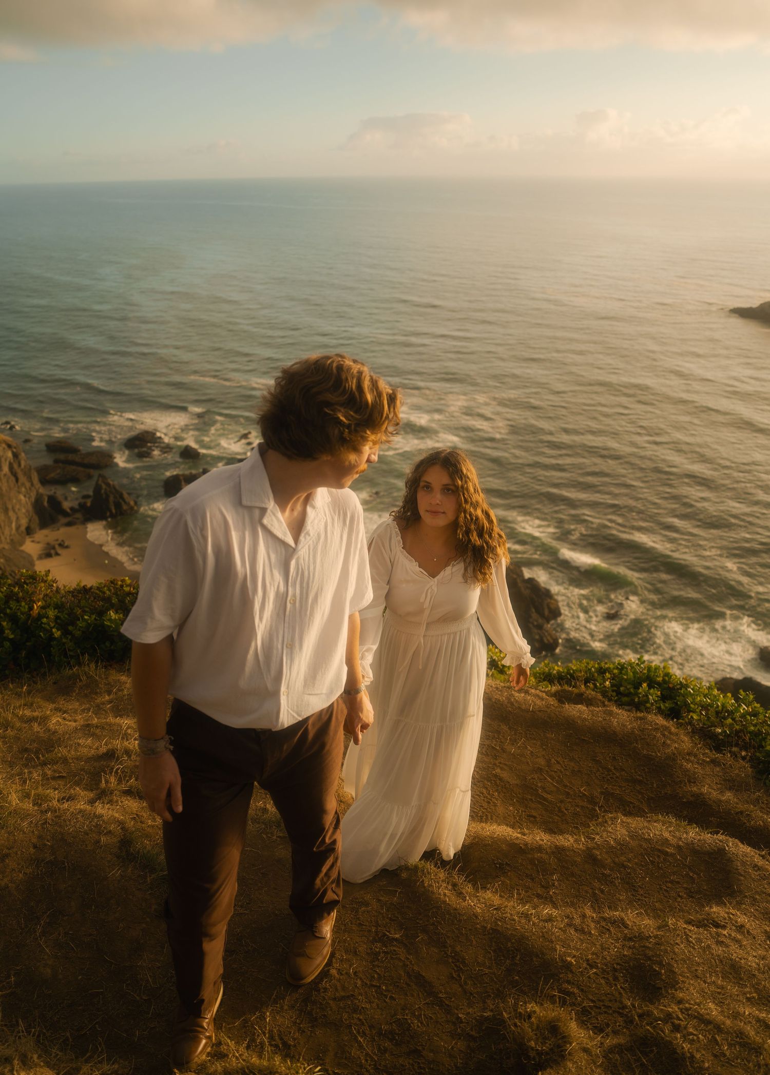 Couple hiking God's Thumb on the Oregon Coast