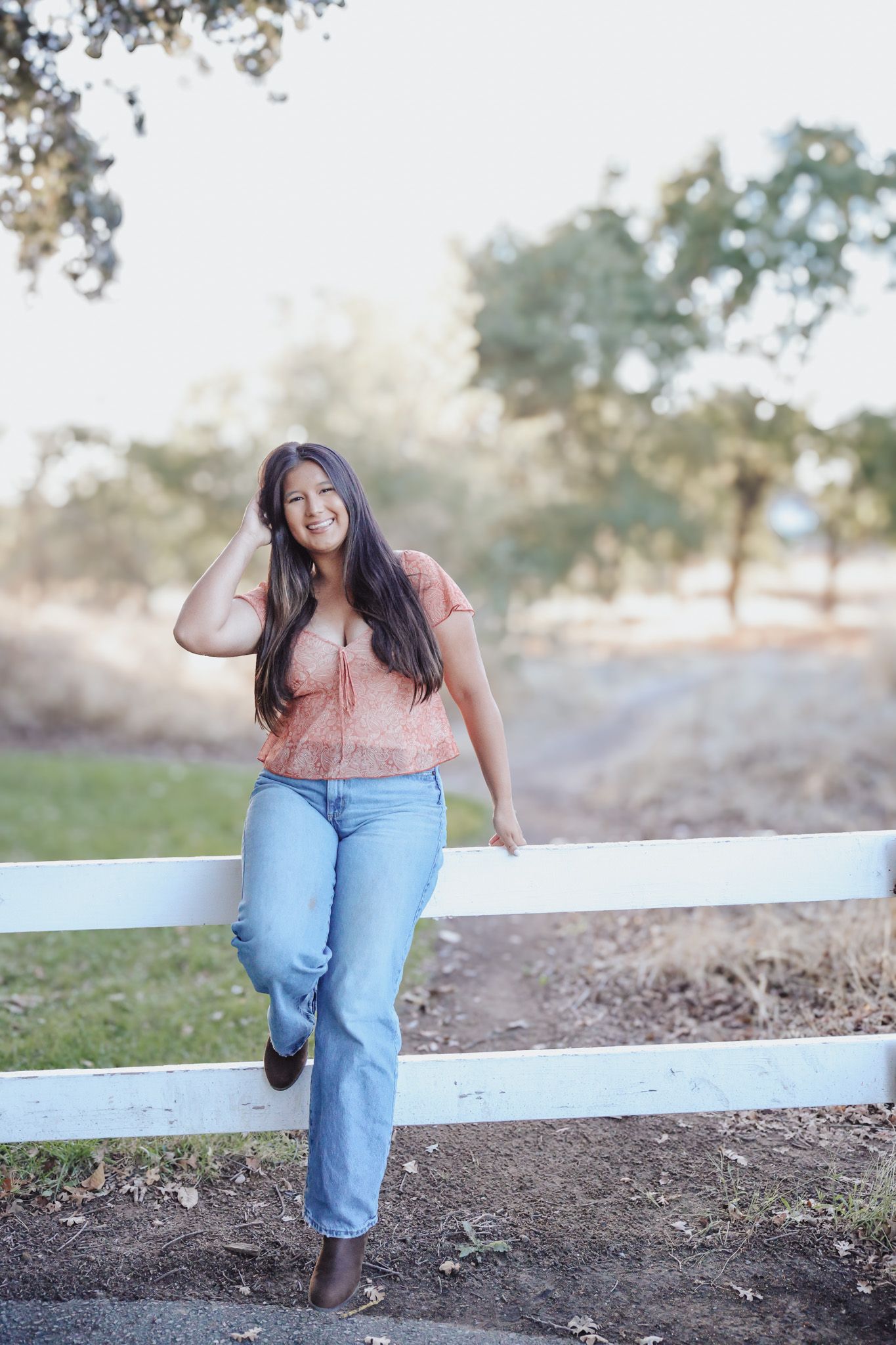 Outdoor senior portrait session in Elk Grove CA during golden hour with natural light and personality‑driven styling
