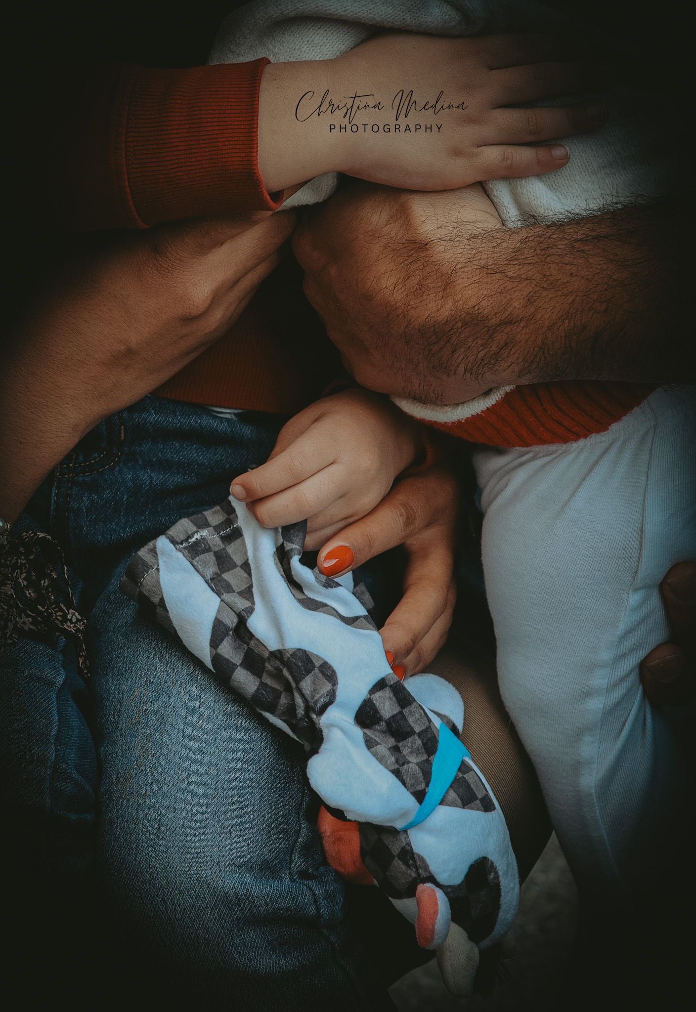 A series of intimate close-up shots showing hands gently holding and examining a small newborn puppy.