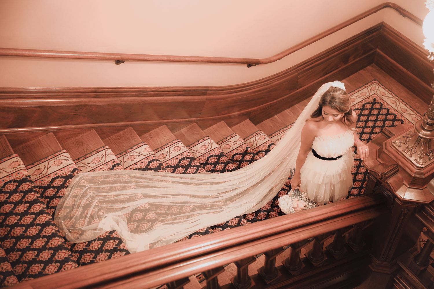A sequence of sepia-toned images showing an ornate staircase with cast iron railings and intricate woodwork details.