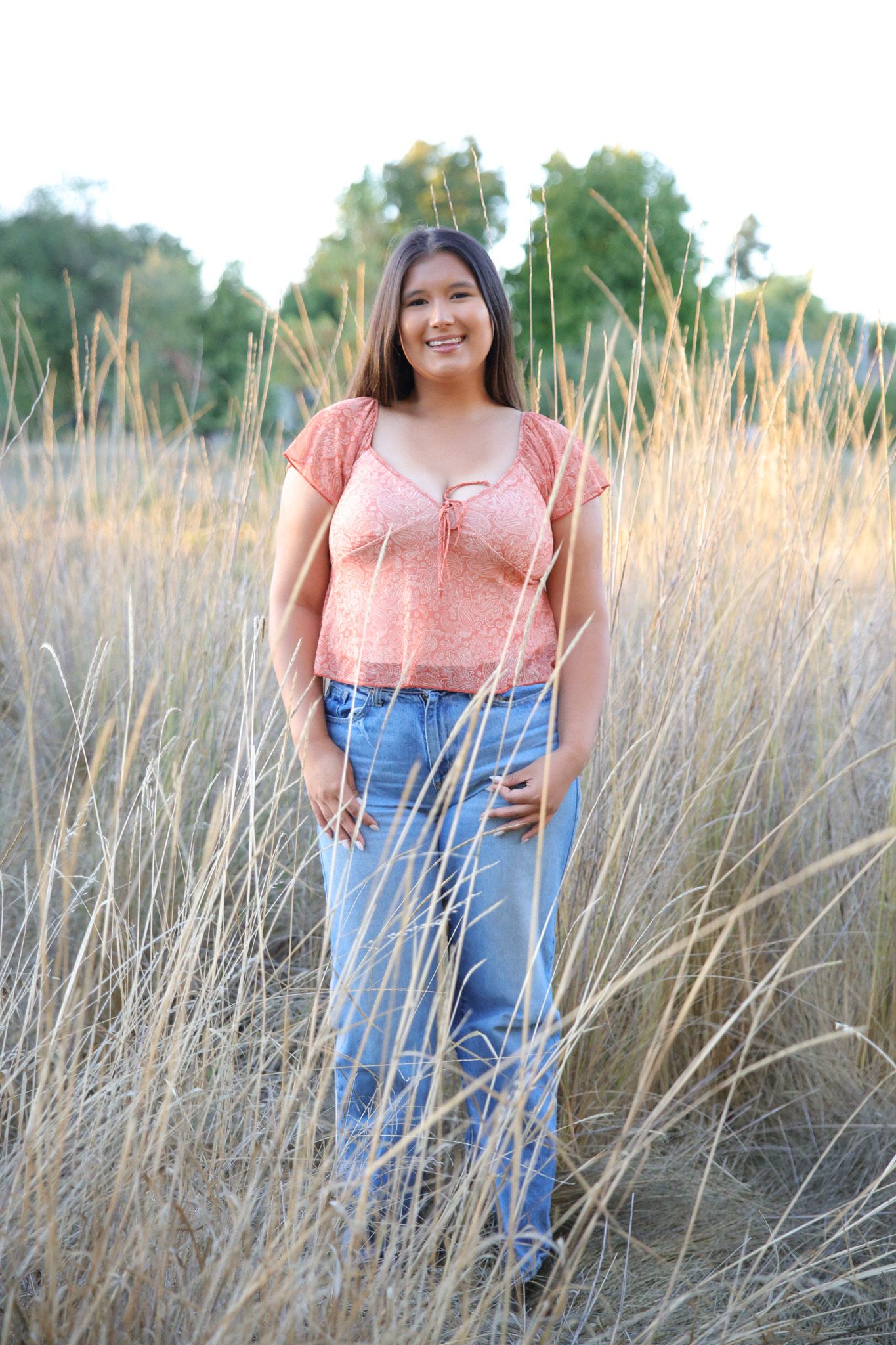 Elk Grove senior portraits captured outdoors in warm natural light with expressive, personality‑driven posing.