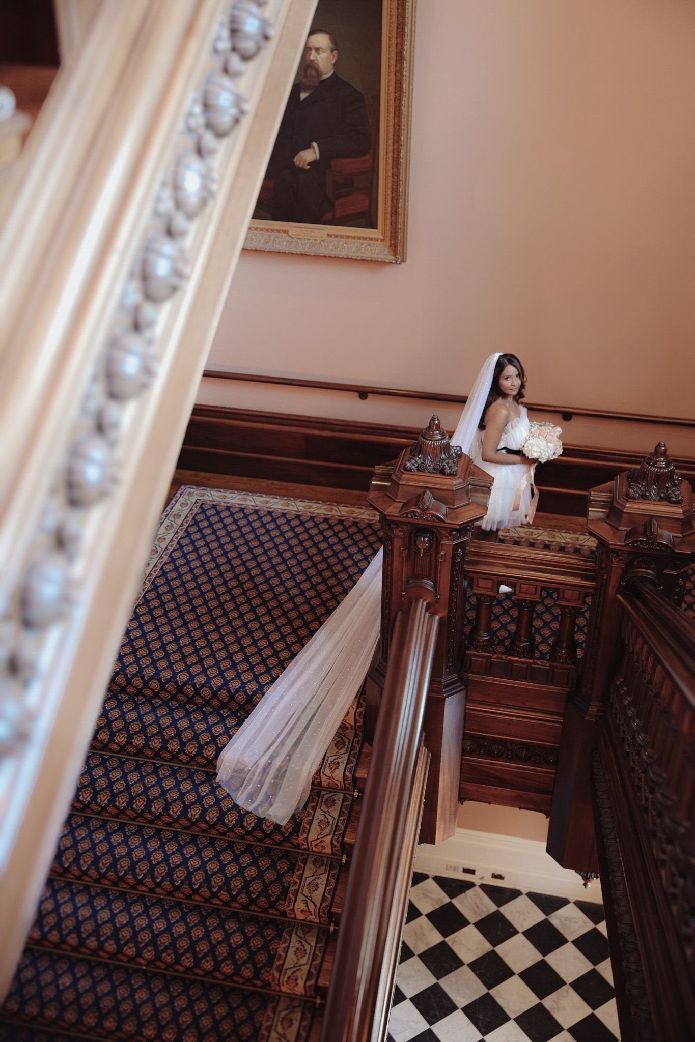 Bride photographed indoors at the California State Capitol in Sacramento with soft natural light and elegant architectural details.