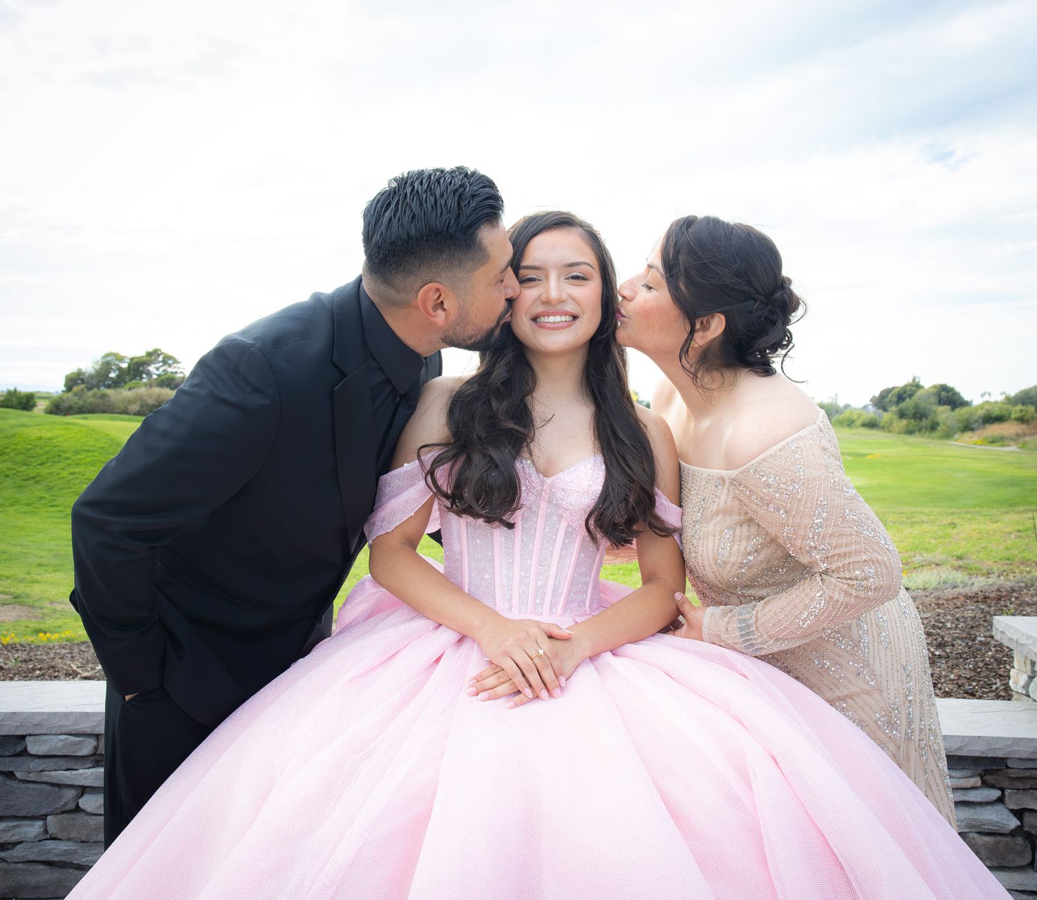 Outdoor photo of the parents at the Oakland, CA quinceañera celebration.