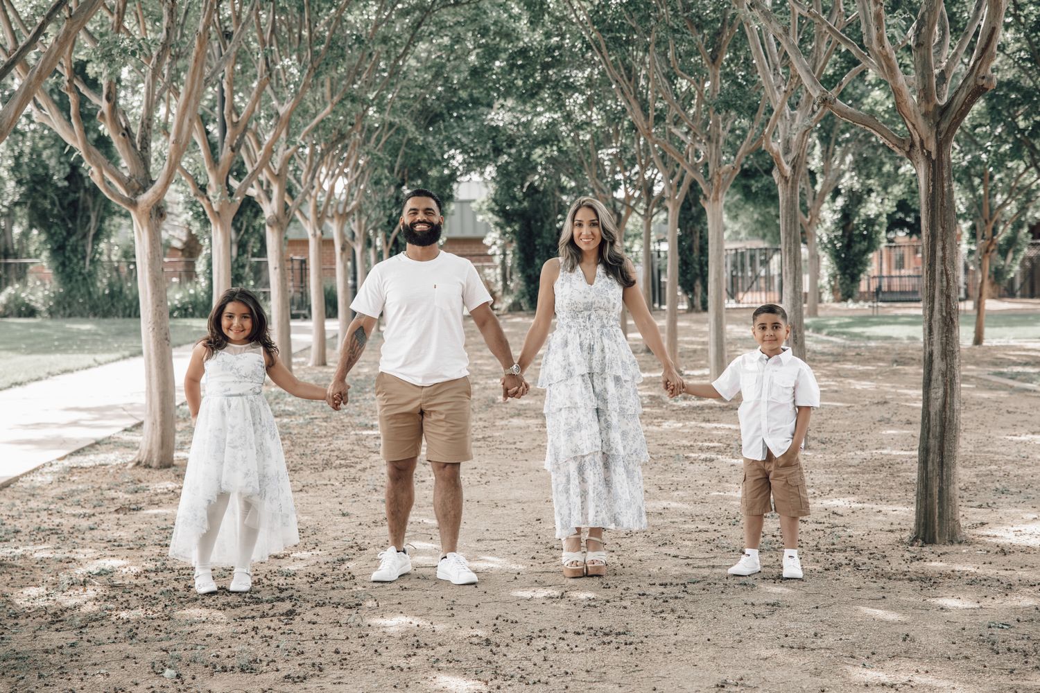 Family portrait featuring parents and children sharing candid, joyful moments together