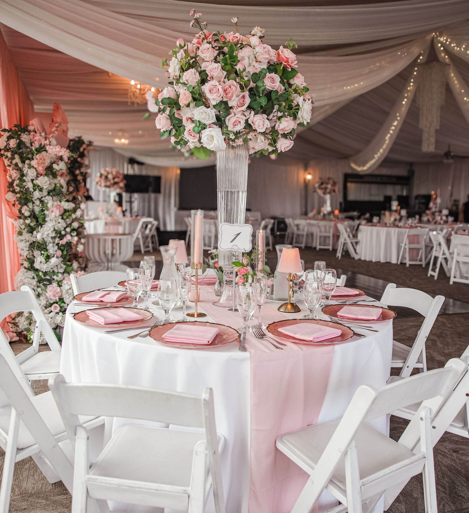 Elegant quinceañera table decor at the Oakland, CA venue, captured in bright natural light.