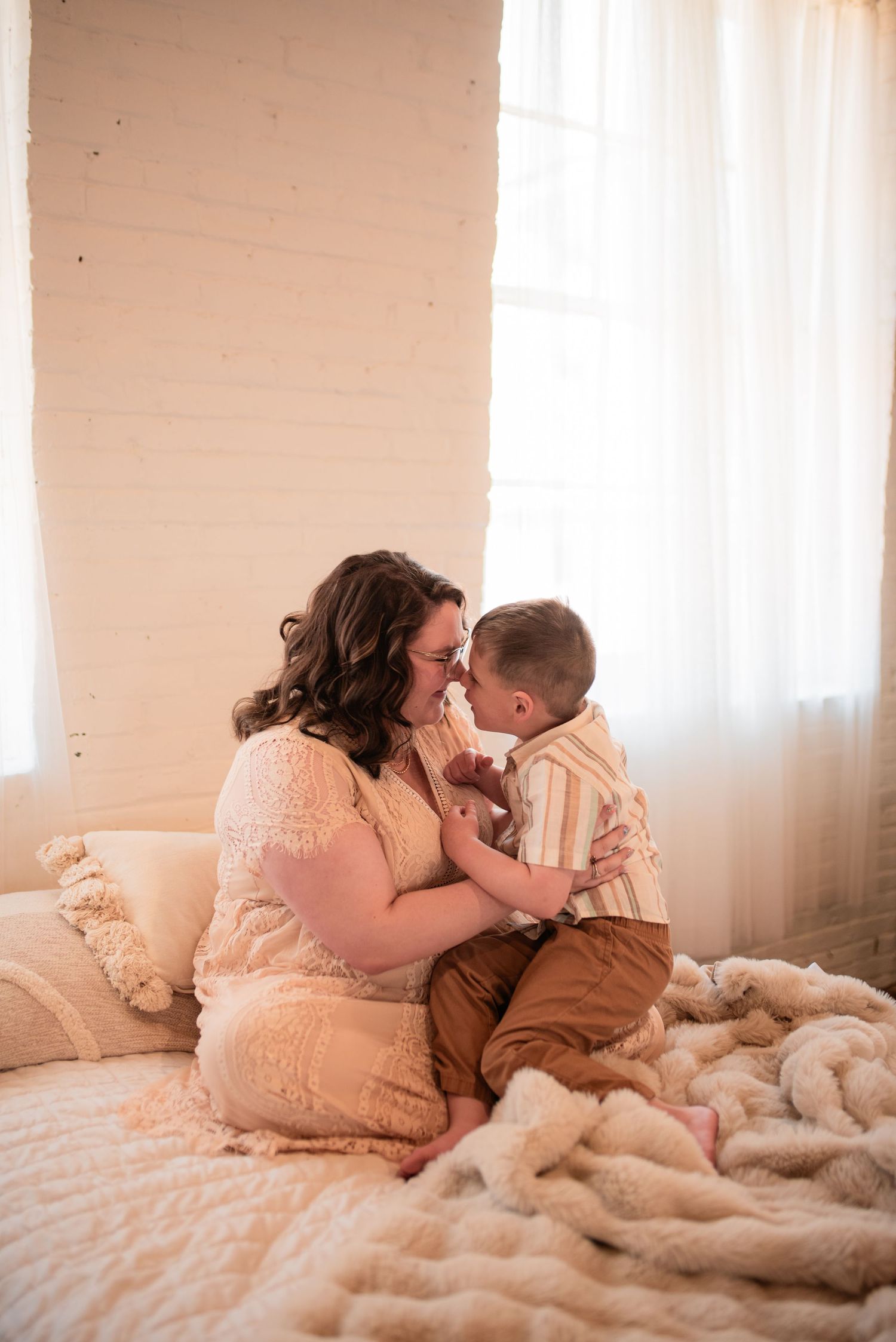 Mother and son snuggle in connection led photoshoot in studio space in Bethlehem Pennsylvania